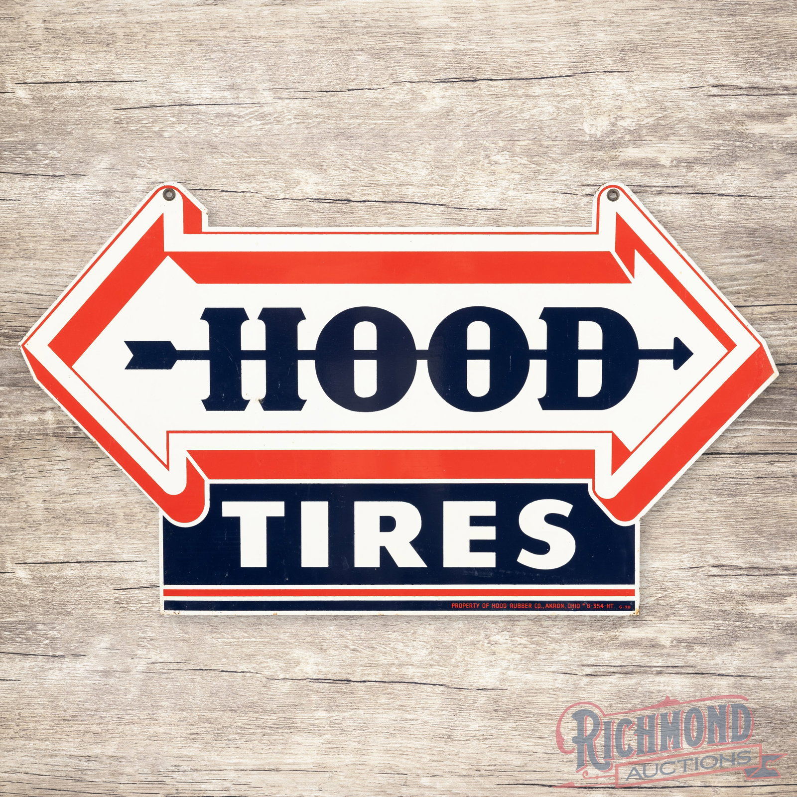 Hood Tires Double Sided Tin Die Cut Sign w/ Arrow: DST (double sided tin) die cut sign has excellent color and shine. The display has light wear in the fields with faint paper marks. The perimeter has small paint chips along the outer edges. The rever