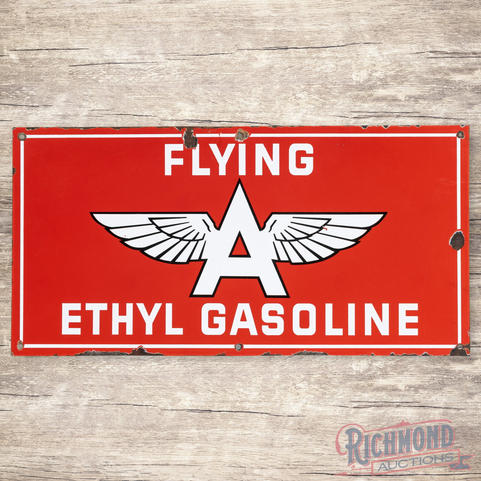 Flying A Ethyl Gasoline 26" Single Sided Porcelain Logo Sign: SSP (single sided porcelain) sign has very good color and gloss. The display has small chips in the logo with fine scratches and light wear. The perimeter has chips with wear along the outer edges. Al