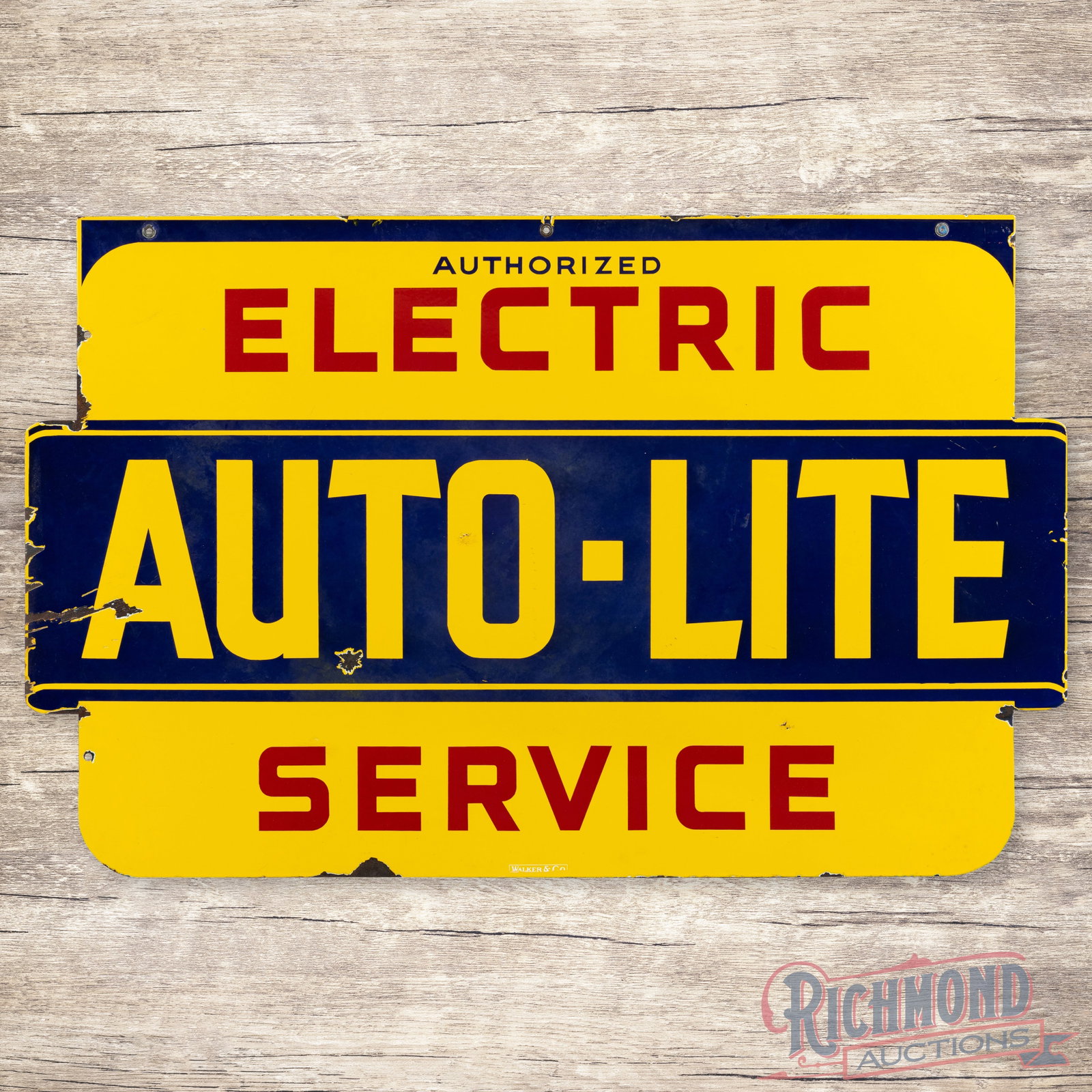 Autolite Authorized Electric Service 4.5' Double Sided Porcelain Sign: DSP (double sided porcelain) die cut sign has good color and gloss. The display has light surface wear with bruises and two chips at the lettering. The blue porcelain enamel has areas of faint cloudin