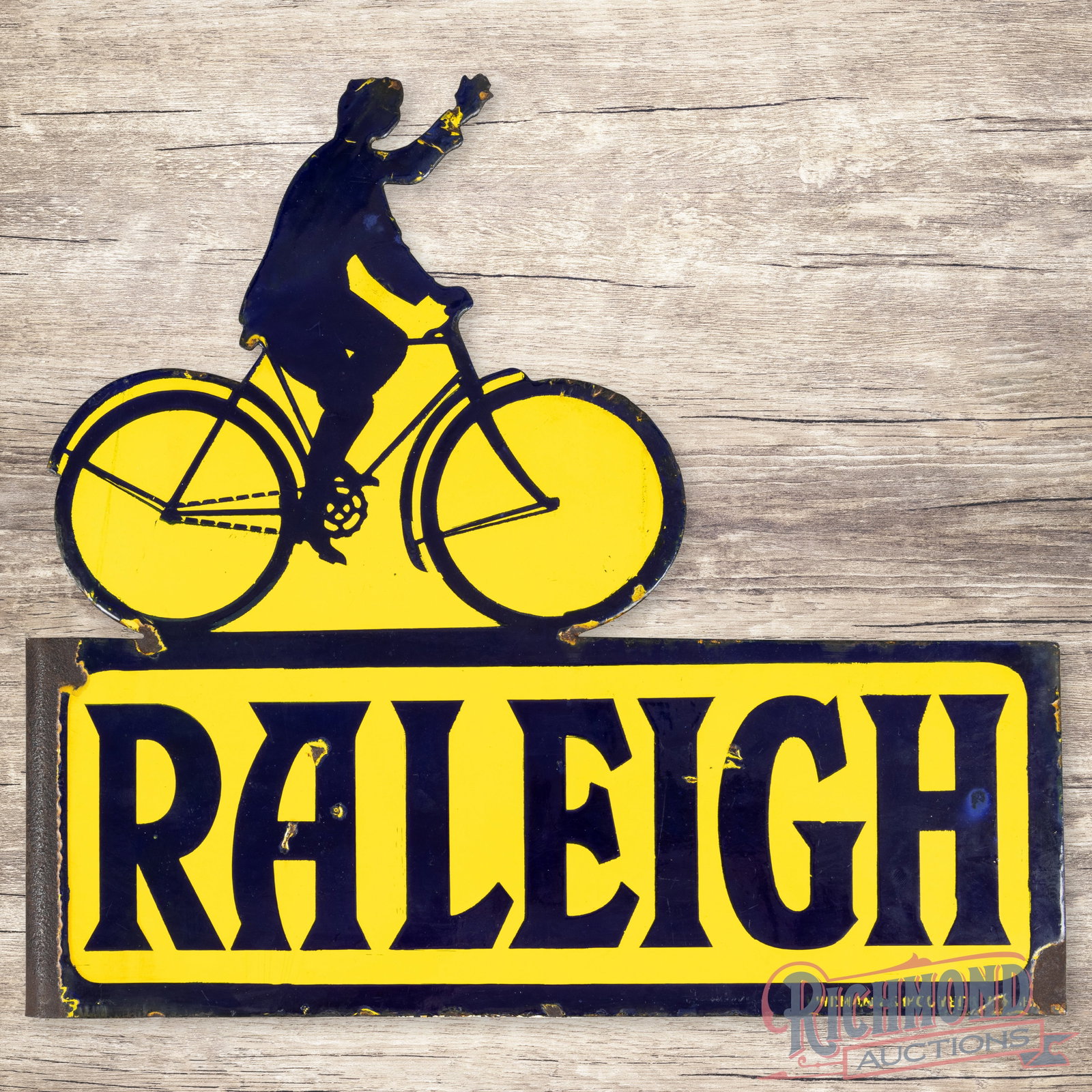 Scarce Raleigh Bicycles Die Cut Double Sided Porcelain Flange Sign: DSP (double sided porcelain) die cut flange has very good color and gloss. The display has light wear with small chips in the fields. The perimeter has edge chips with an area of chipping along the fl