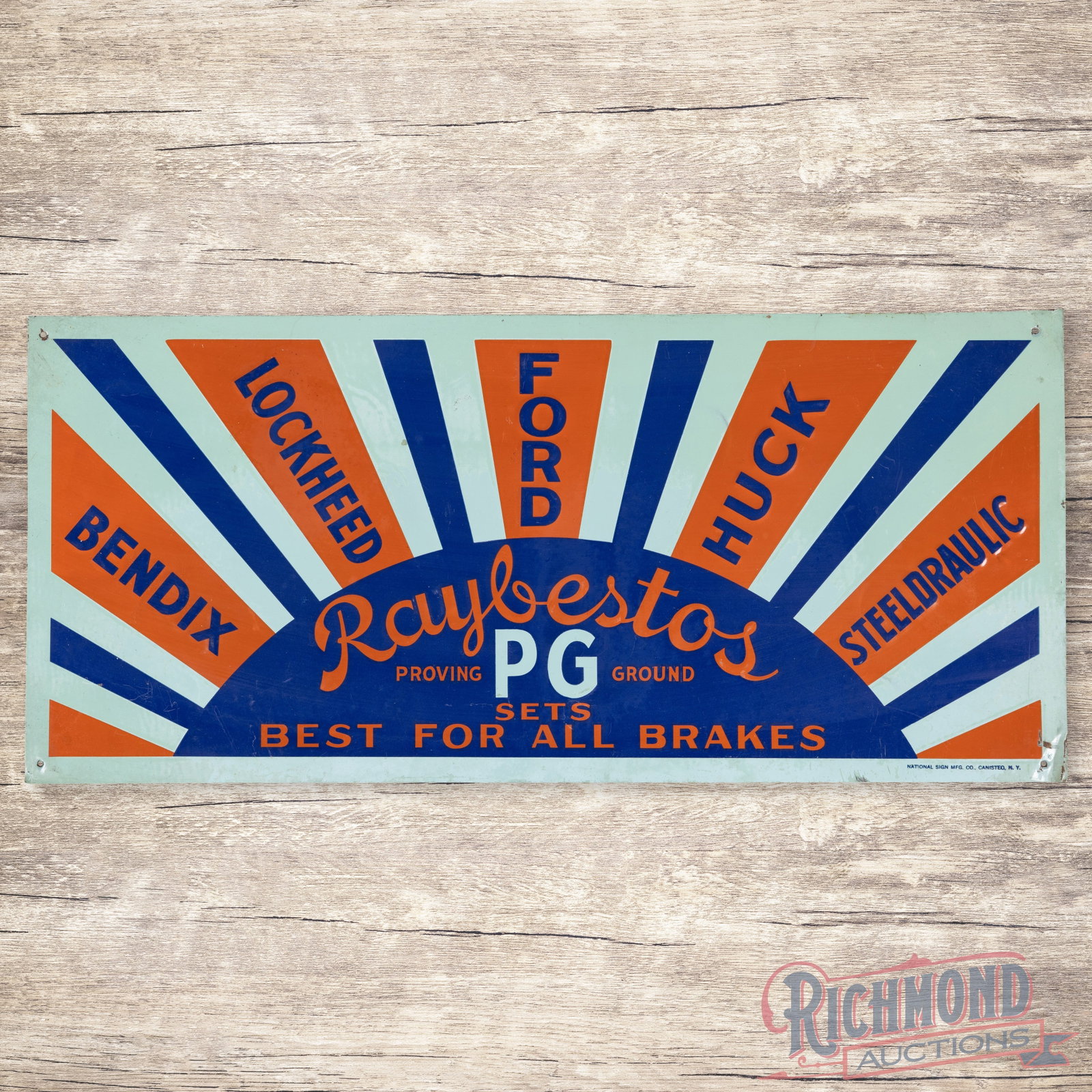 Raybestos Brakes Ford Lockheed Bendix Huck Steeldraulic Emb. Single Sided Tin Tacker Sign: SST (single sided tin) embossed tacker sign has very good color and shine. The display has light wear with areas of discoloration and lower shine. The perimeter has minor bends, fine scratches and sma