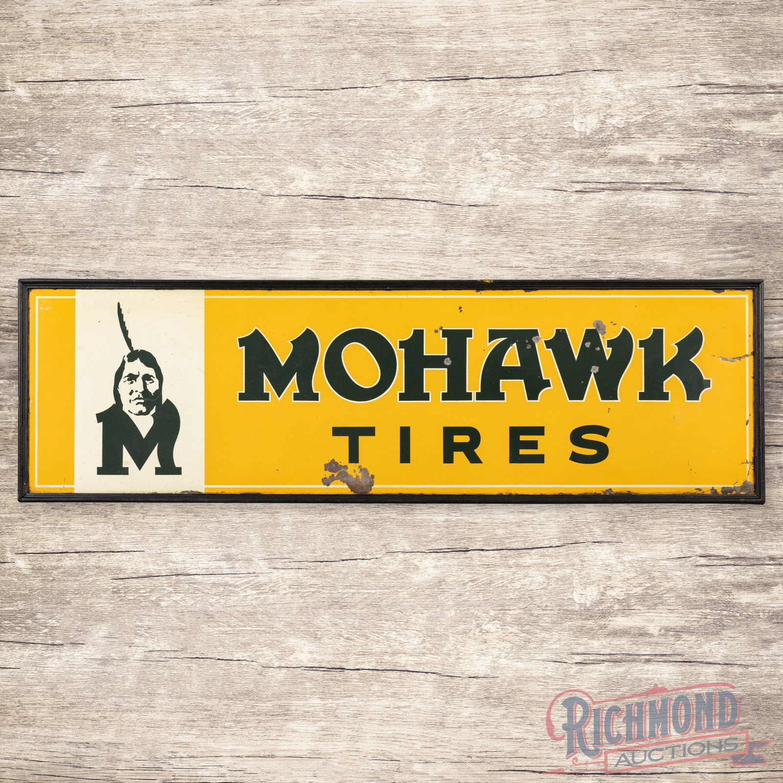 Mohawk Tires 5' Single Sided Tin Sign w/ Wooden Frame & Native American Logo: Early SST (single sided tin) sign with the factory wooden frame has good color and shine. The fields have light wear, minor discoloration and paint chips in the "Mohawk" lettering. The perimeter has a