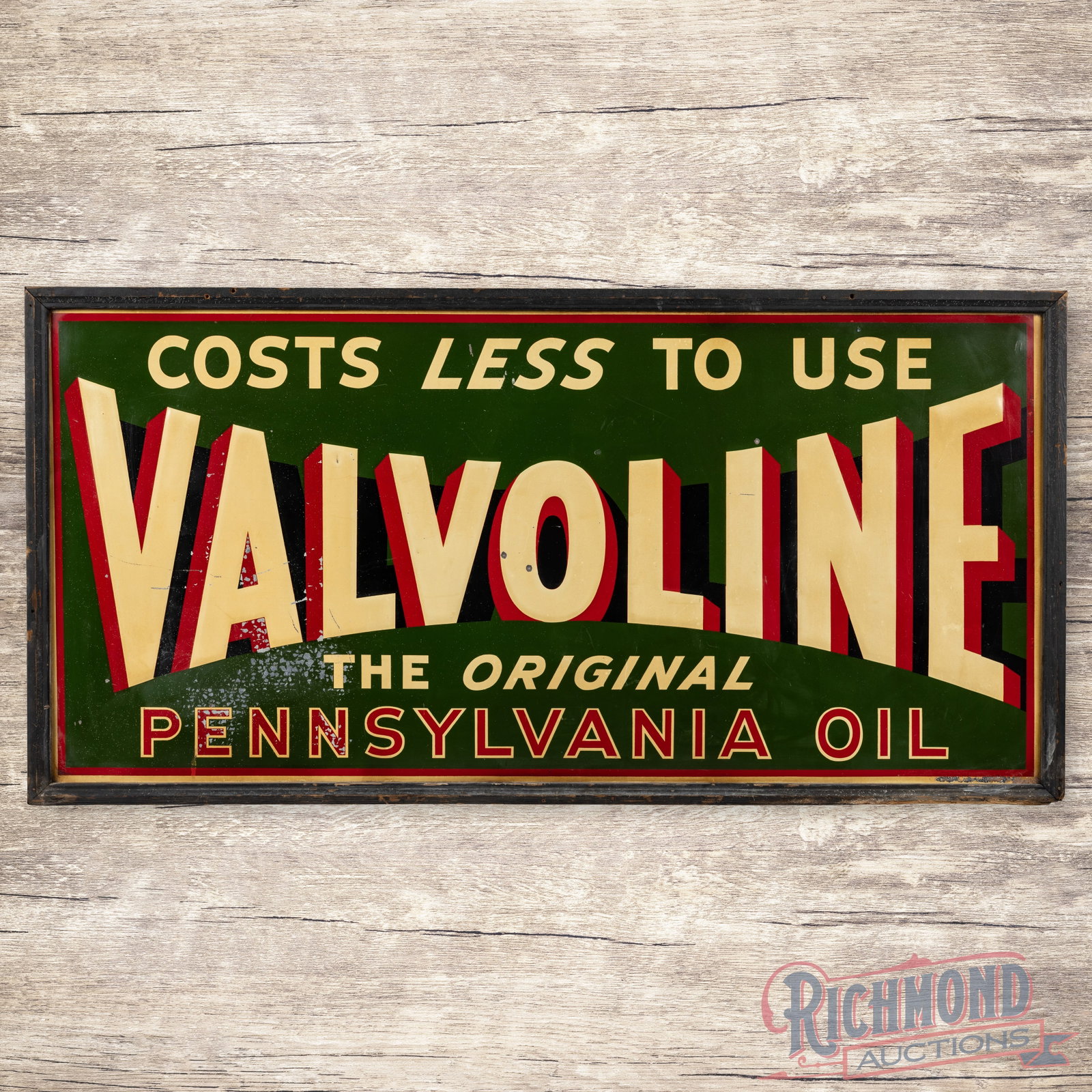 Valvoline The Original Pennsylvania Motor Oil Costs Less to Use 6' Emb Single Sided Tin Sign "Large": SST (single sided tin) embossed sign with the original wooden frame has good color and shine. The display has toning, small dings, fine scratches and paint chips. The perimeter has minor edge bends wi