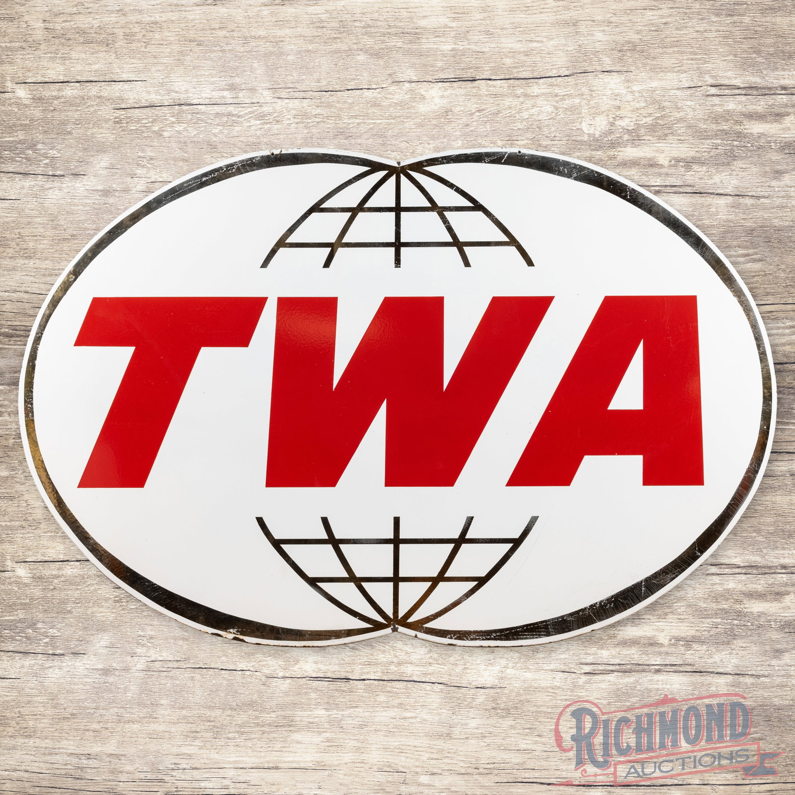 TWA Trans World Airlines 6' Single Sided Porcelain Logo Sign: SSP (single sided porcelain) die cut cookie cutter edge sign has excellent color and gloss. The display has tiny flea bites with marks in the lower right outer field. The perimeter has areas of crazin