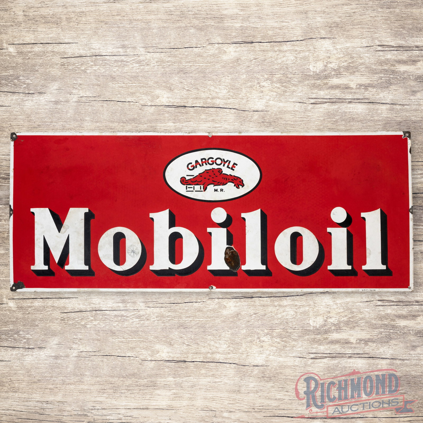 Scarce 4.5' Mobiloil Gargoyle Single Sided Porcelain Sign: Unique SSP (single sided porcelain) Mobiloil sign has excellent color and good gloss. The field has a large chip with some discoloration through the white and some cloudy spots in the red. Marked at t