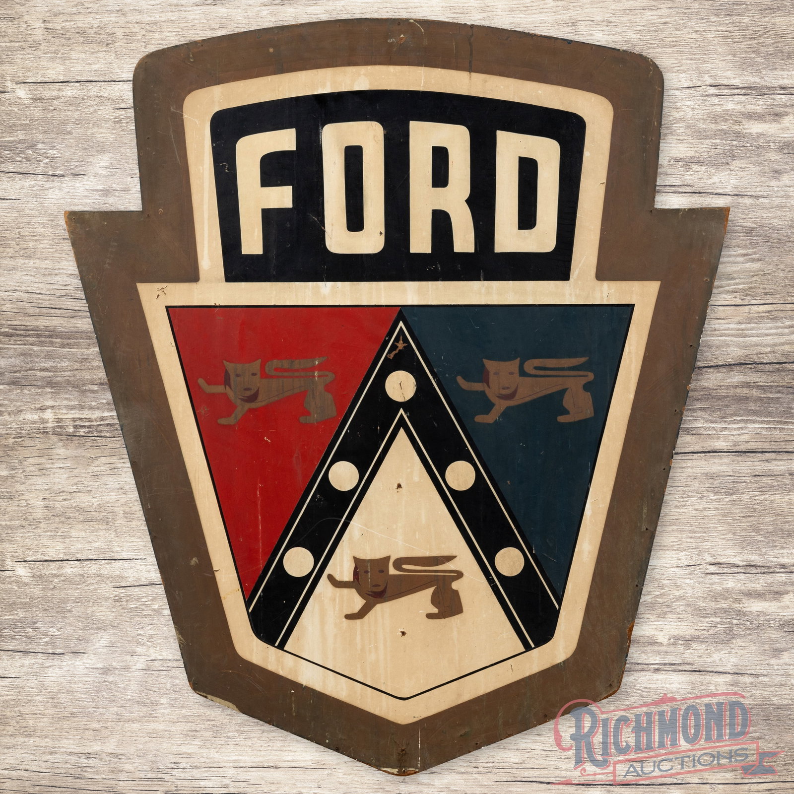 SS Masonite Ford Crest Sign w/Original Frame: SS Masonite Ford sign showing general signs of age related wear. Some spots of loss and discoloration. Sign is mounted the original frame and has excellent patina. 39" H X 33.5" W. Condition: 7.75 All