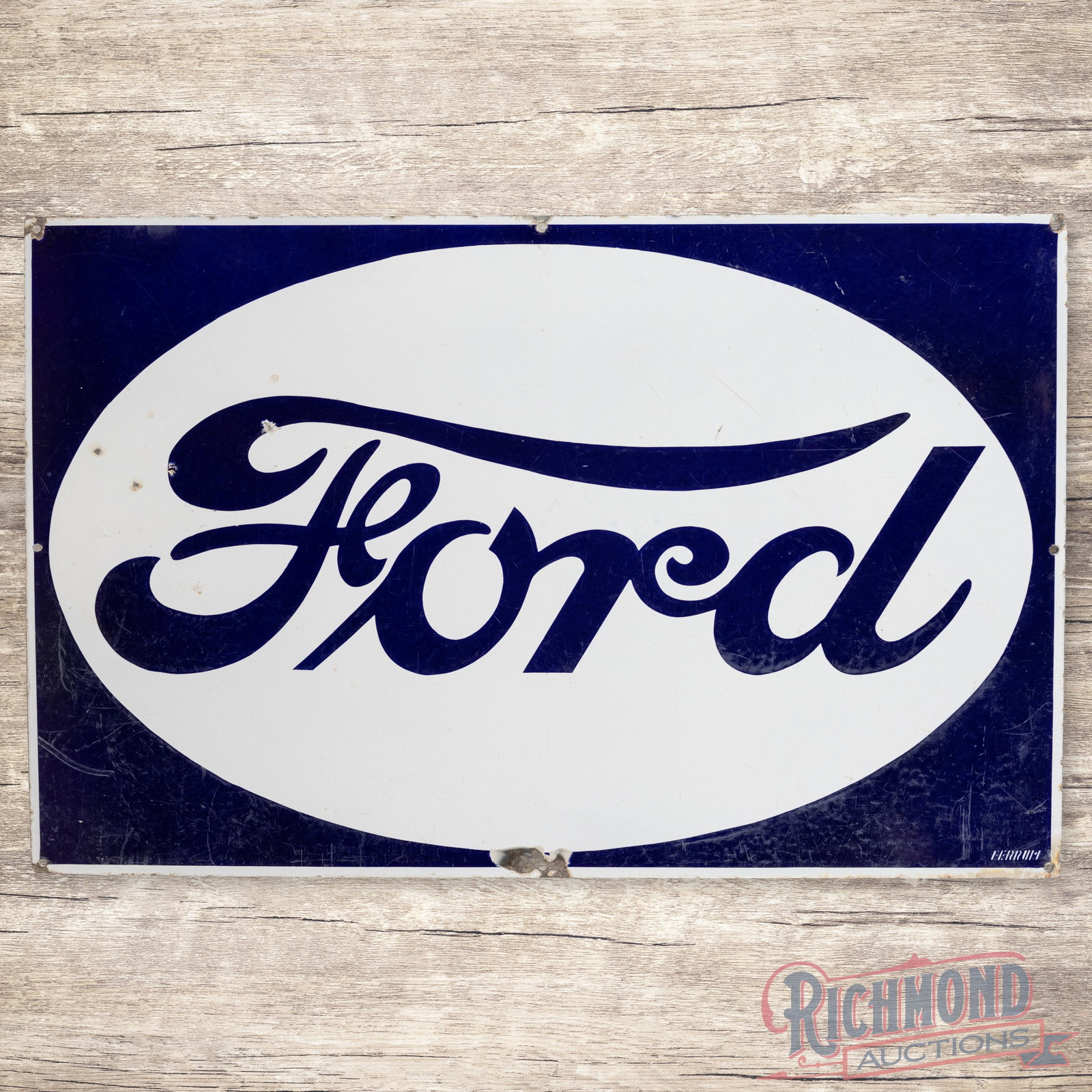 39" Ford Single Sided Porcelain Sign w/Reverse Colors: SSP (single sided porcelain) Ford Sign w/Reverse Color shows good color and gloss. Exhibits age related surface wear and some chipping. Marked Ferrum in the lower right corner. 25" H X 39.25" W. Condi