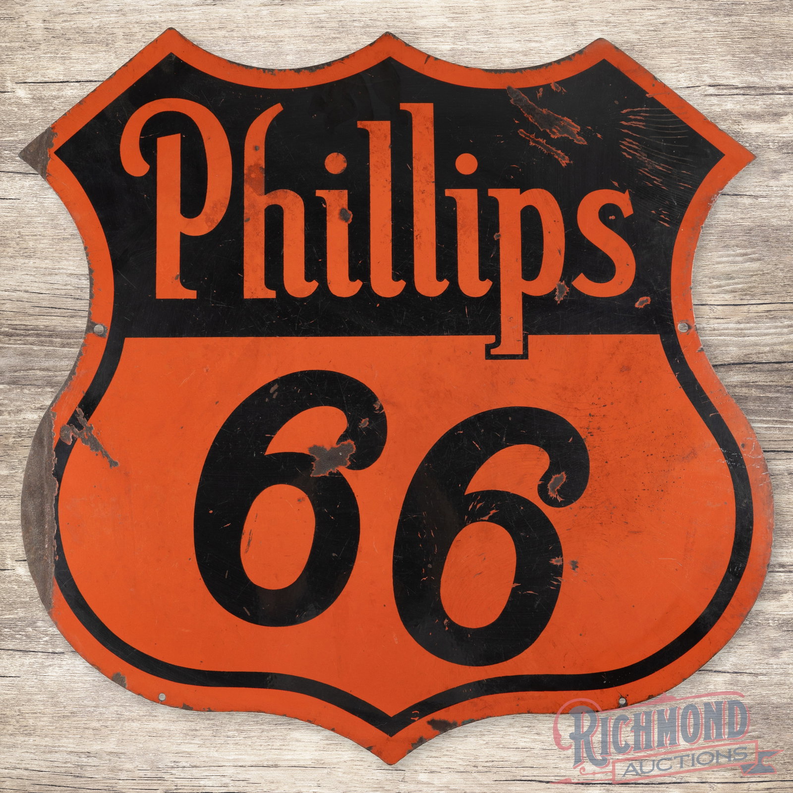 30" Phillips 66 Orange/Black Double Sided Porcelain Shield: Phillips 66 DSP (double sided porcelain) Sign. Both sides exhibits good color with moderate gloss. There are chips and porcelain loss on both sides. The bottom edge was bend and folded back at some po