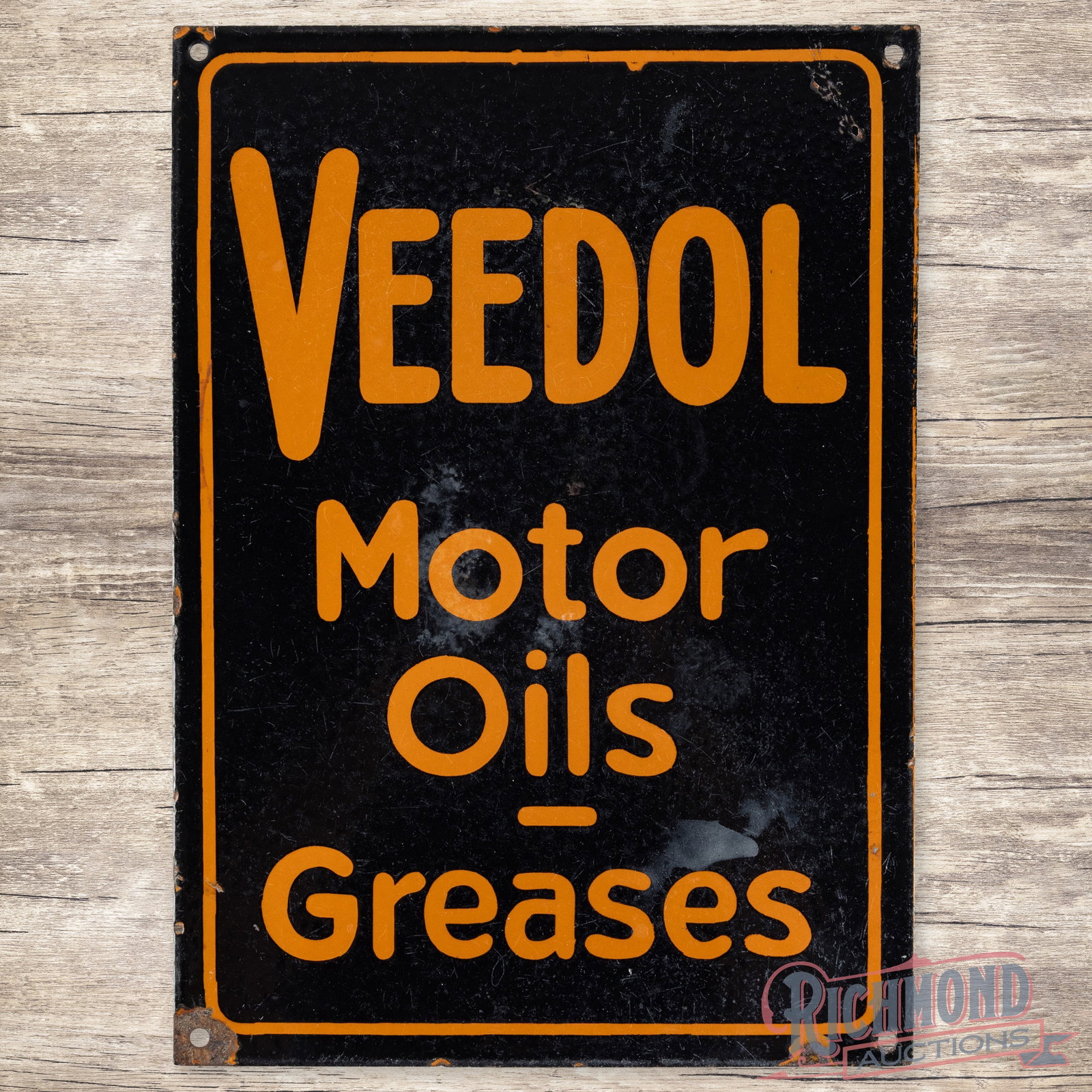 Veedol Motor Oils Greases Sign: SSP (single sided porcelain) Sign with general surface wear and some discoloration. Light chipping around the edges but overall a nice Veedol sign. 14" H X 10" W. Condition: 8.25 All items are guarant