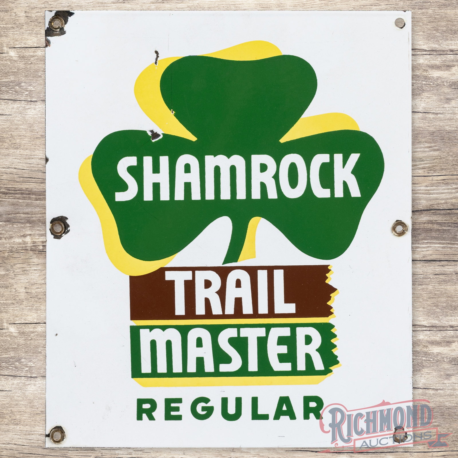 Shamrock Trail Master Regular Gasoline Single Sided Porcelain Pump Plate Sign: SSP (single sided porcelain) pump plate has very good color and gloss. The display has light wear with chips in the left upper fields. The perimeter has chips at the mounting holes with slight bends a