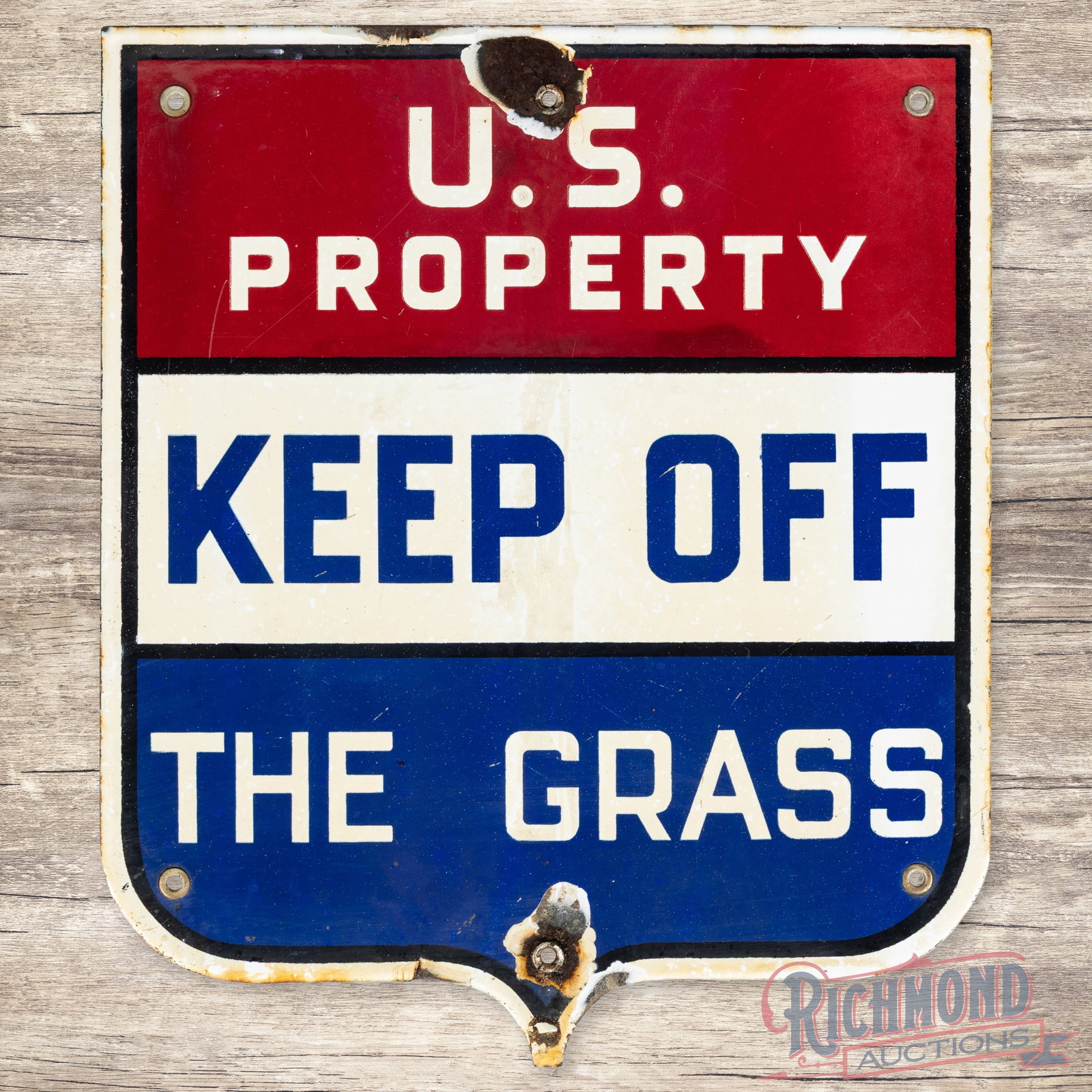 U.S. Property Keep Off The Grass Die Cut Single Sided Porcelain Sign: SSP (single sided porcelain) die cut sign has good color and gloss. The display has light wear with discoloration. The perimeter has chips at the mounting holes and edges. Six factory grommets are pre