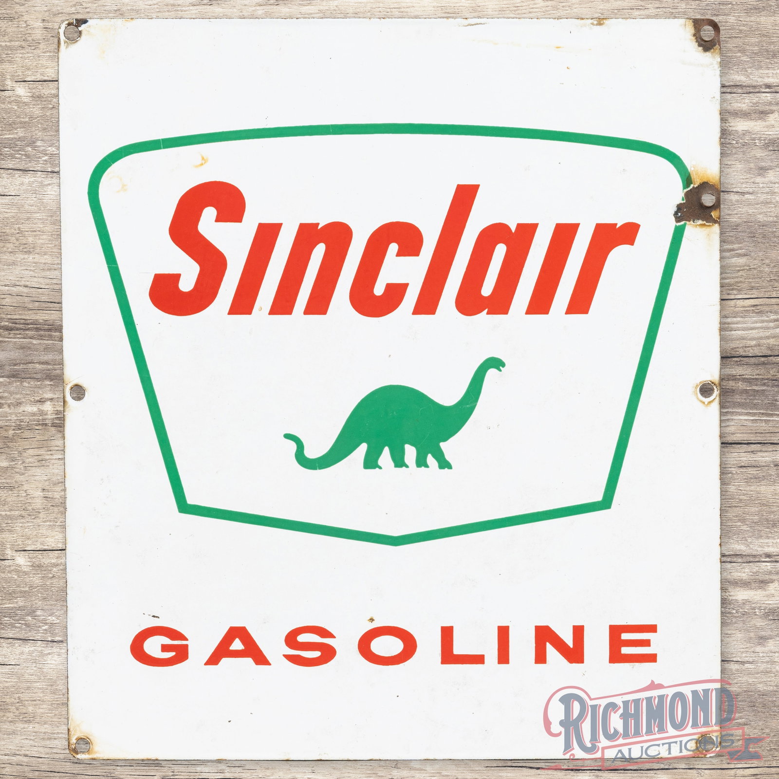 Sinclair Gasoline Single Sided Porcelain Pump Plate Sign w/ Dino: SSP (single sided porcelain) pump plate has good color and gloss. The field has light wear with a tiny chip in the lower field and small areas of discoloration in the outer fields. The perimeter has a