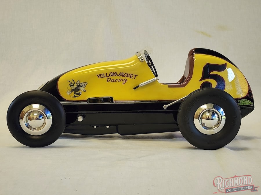 1946 Dooling F Tether Car: This sixth car of the Dooling series was patterned after the Kurtis Kraft midget of the day. The body and pan are magnesium. The car is equipped with a Dooling .61 Yellow Jacket engine that drives