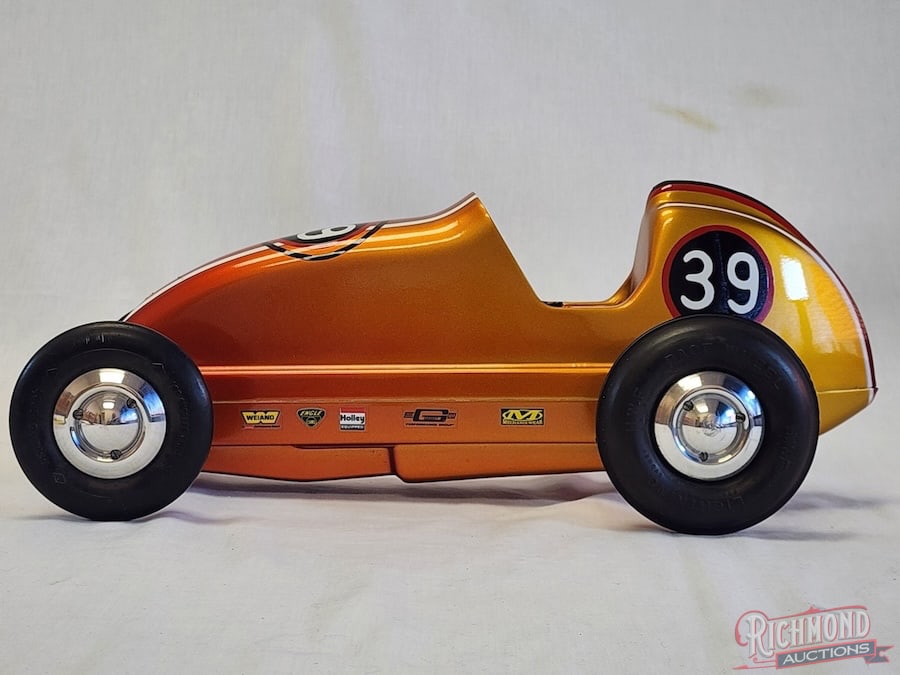 1746 Dooling F Tether Car: This sixth car of the Dooling series was patterned after the Kurtis Kraft midget of the day. The body and pan are magnesium. This example is all original but is non powered. Beautiful custom paint wit