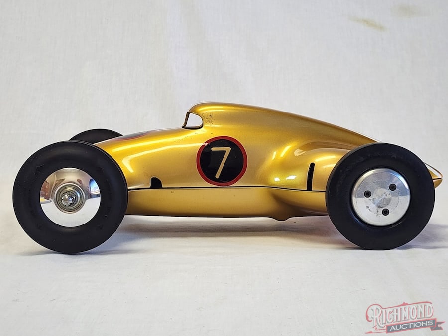 1939 Dooling Streamline Tether Car: n 1939 the Dooling Brothers introduced the Streamliner, nicknamed the Frog. This example is non powered, with beautiful paint and graphics. All items are guaranteed authentic by Richmond Auctions