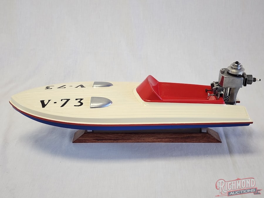Outboard Speedboat: Beautifully painted and powered by a .049 K&B Fury engine. 18 inches long. Stand included. All items are guaranteed authentic by Richmond Auctions unless otherwise noted. Purchases are eligible for