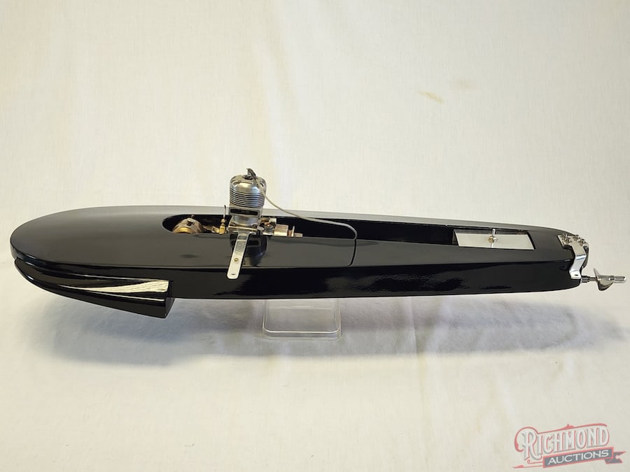 Hydroplane Tether Boat: Completely equipped and powered by a Hornet .60 engine. 28 inches long. Stand included. All items are guaranteed authentic by Richmond Auctions unless otherwise noted. Purchases are eligible for free 