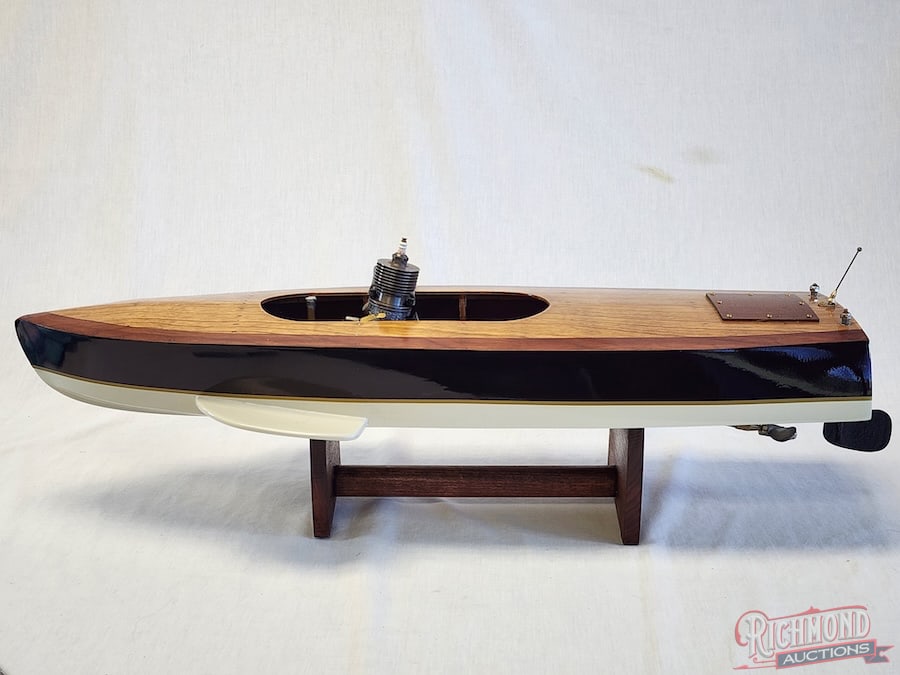Chris-Craft Tether Boat: Beautifully restored with all accessories. Powered by an O.K. Super .60 engine. 27 inches long. Stand included. All items are guaranteed authentic by Richmond Auctions unless otherwise noted.