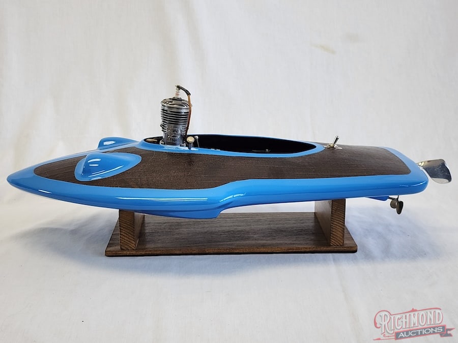 Hydroplane Tether Boat: Beautifully painted with all accessories. Powered by a Super Cyke .60 engine. 22 inches long. Stand included. All items are guaranteed authentic by Richmond Auctions unless otherwise noted. Purchases 