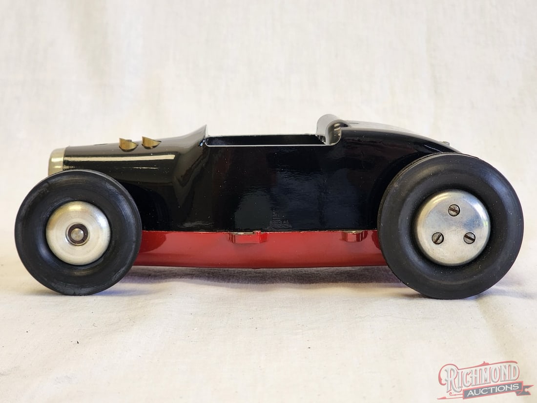 1950 Rodzy Mite Tether Car: Built by Robert Cameron of Cameron Engineering of Sonora, California. This Hot Rod style mite tether car is powered by a Cameron .15 engine. Throw a set of spur gears. A fine example of an all origina