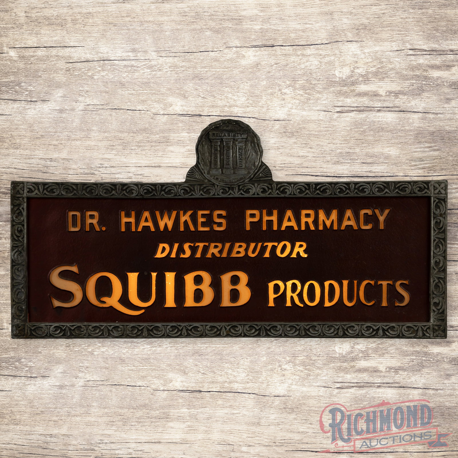 Dr. Hawkes Pharmacy Distributor Squibb Products Emb. Lighted Advertising Sign: Embossed glass internally lighted sign with ornate trim and metal can works properly. The glass face has light wear with crackled paint. The ornate trim is in very good condition. The metal can is in 