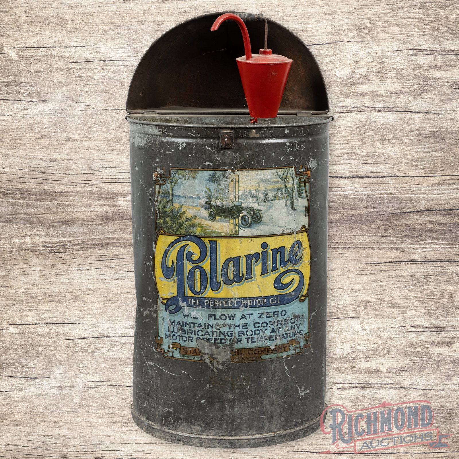 Standard Motor Oil Polarine "The Perfect Motor Oil" Drum Barrell w/ Early Automobile: Early Polarine oil barrel has good color and shine. The barrel features graphics of an early touring car with a winter scene. It exhibits general wear with paint loss, scratches and dents. The origina