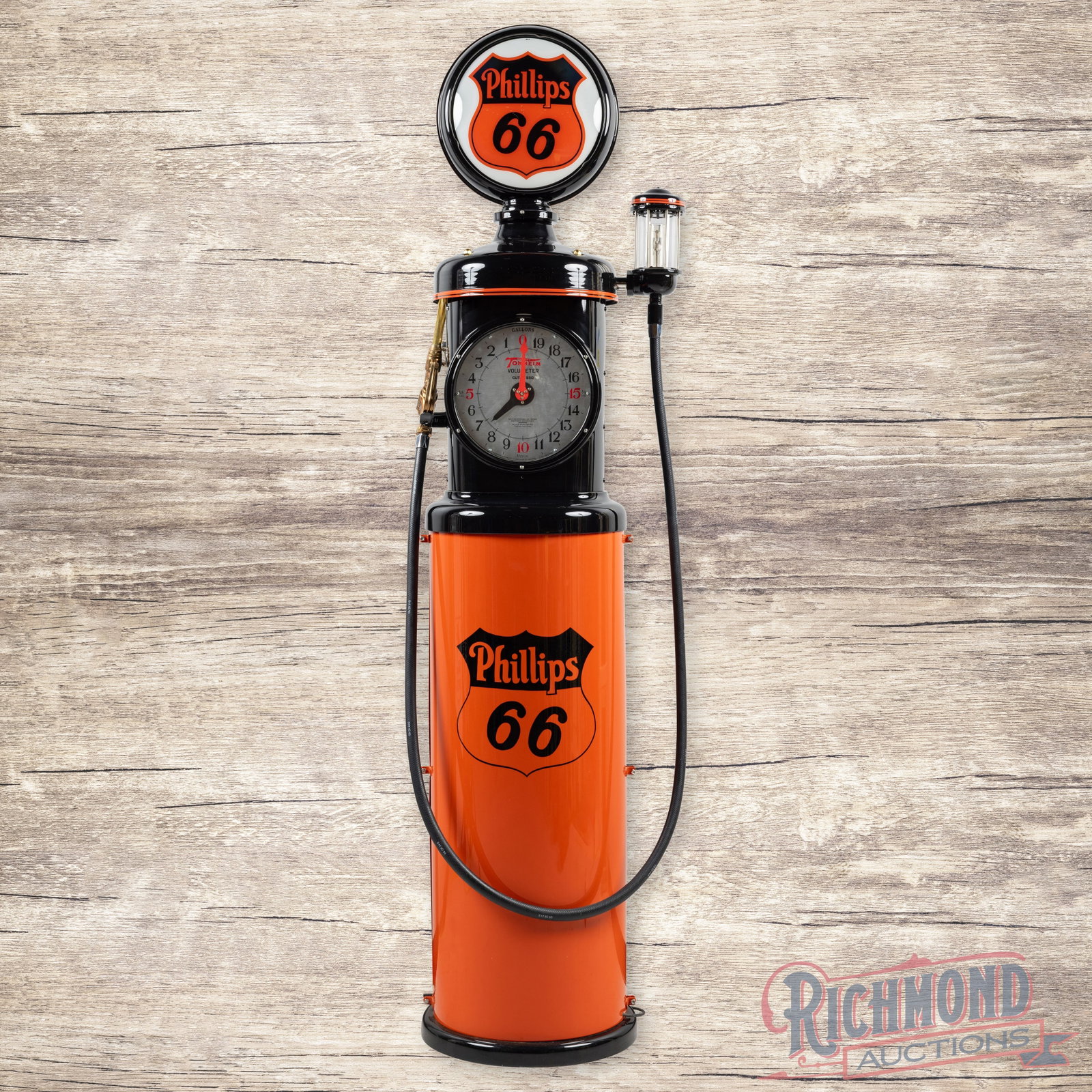 Tokheim Model #850 Clockface Gas Pump Professionally Restored Phillips 66 Gasoline: Tokheim model #850 has been professionally restored. The pump features vibrant orange and black paint with high gloss. It includes painted logos, a brass nozzle, a hose, visi-gauge, and a lighted 15" 