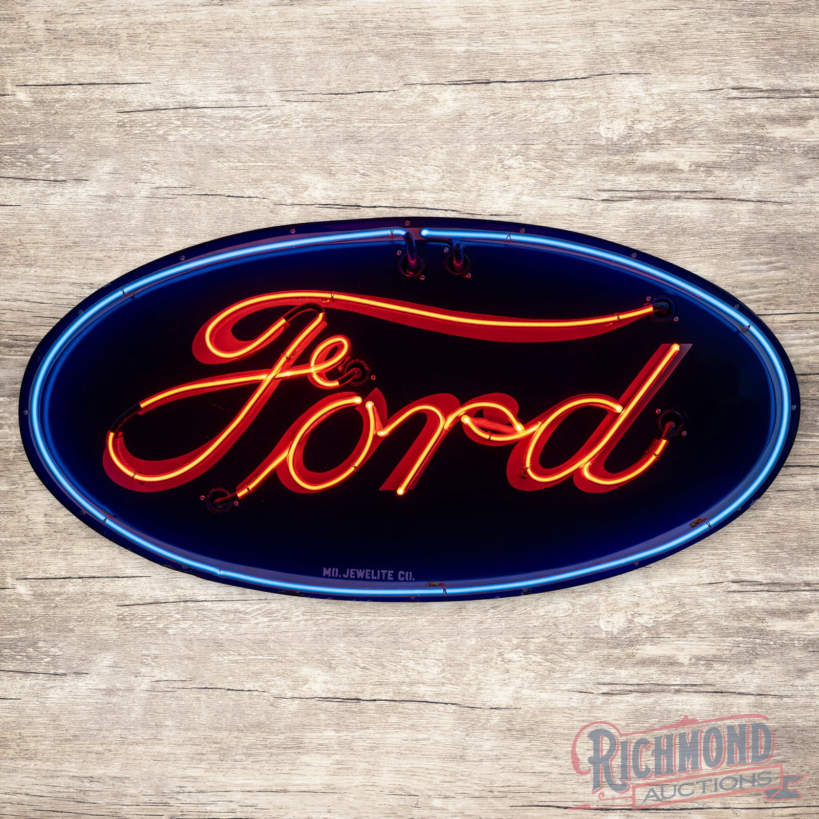 Ford Automobiles 4' Double Sided Porcelain Factory Neon Sign: DSP (double sided porcelain) factory neon sign with the original can has very good color and gloss. The sign features brilliant two-color neon with the classic Ford blue oval design. Side #1 has areas