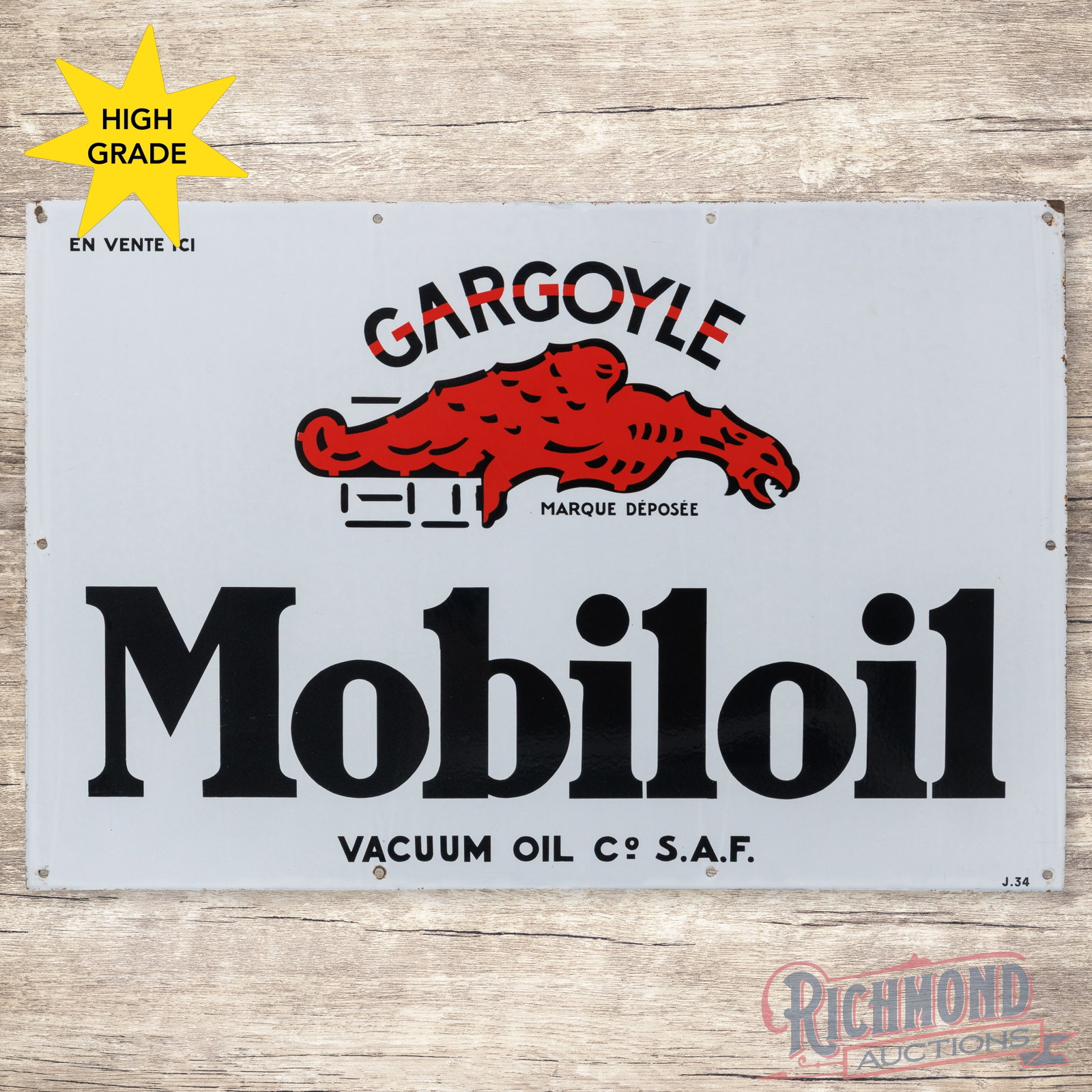 Gargoyle Mobiloil Vacuum Oil Co. 4' Single Sided Porcelain Sign: SSP (single sided porcelain) sign has excellent color and gloss. The fields are clean. The perimeter has light wear with minor chips. Marked J. 34. Overall a fantastic example with heavy shelving and 