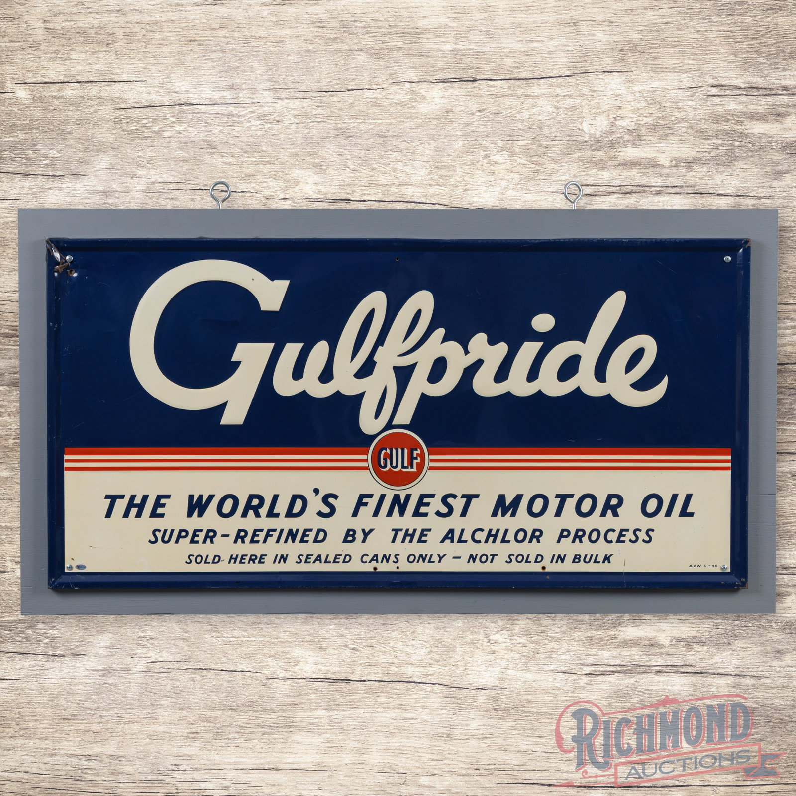 1948 Gulfpride The World's Finest Motor Oil Emb. Single Sided Tin Sign w/ Logo: SST (single sided tin) embossed self-framed sign with an added wooden support frame has excellent color and shine. The display has light wear with a faint horizontal bend through the "G" in the upper 