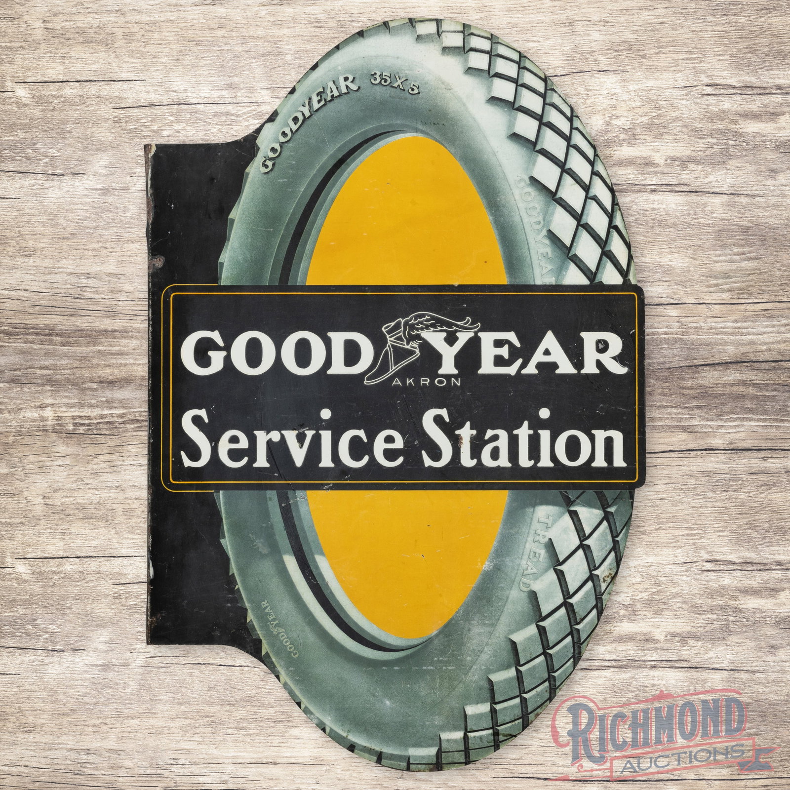 Goodyear Service Station Double Sided Tin Flange Sign: DST (double sided tin) die cut flange has good color and shine. Side #1 has slight fading with small paint chips and fine scratches in the fields. The perimeter has minor oxidation with small paint ch