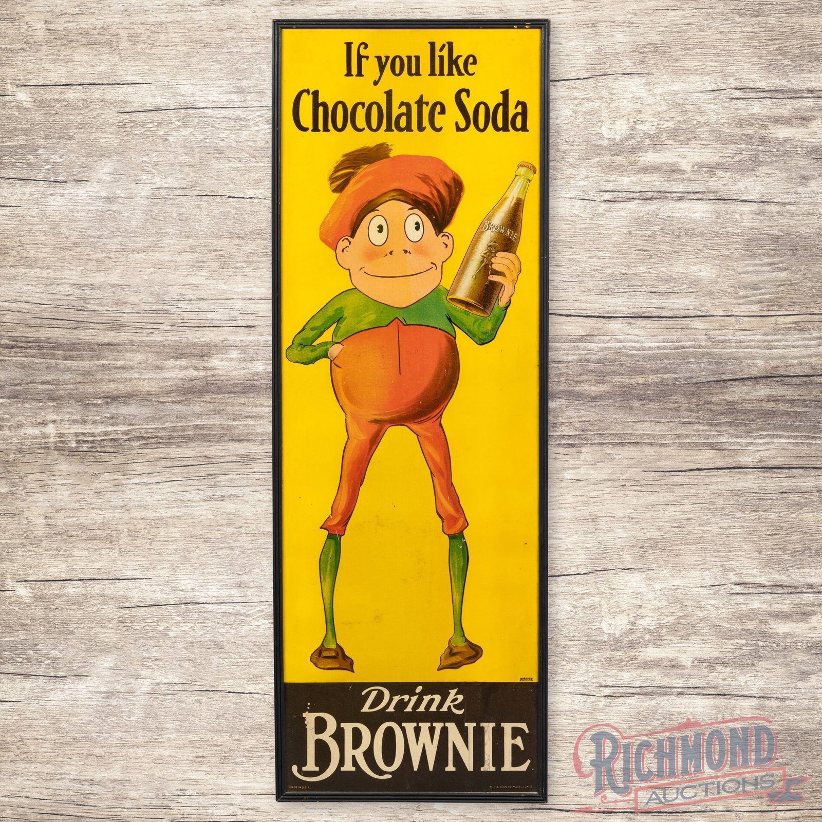 Drink Brown Chocolate 5' SS Sign w/ Wooden Frame: Single-sided cardboard sign with a wooden frame has very good color and shine. The field has light wear with small surface imperfections. The lower fields have scratches with small paint chips. The pe