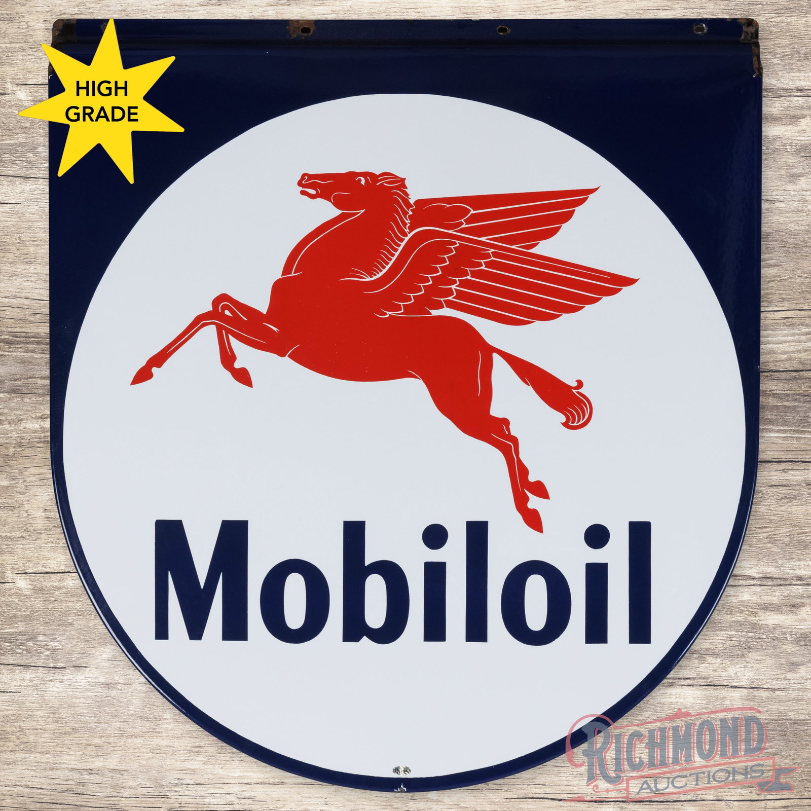 Mobiloil Single Sided Porcelain Sign w/ Pegasus: SSP (single sided porcelain) rolled-edge sign has excellent color and gloss. The display is clean and features a large Pegasus graphic in the center field. The perimeter has small chips at the upper m