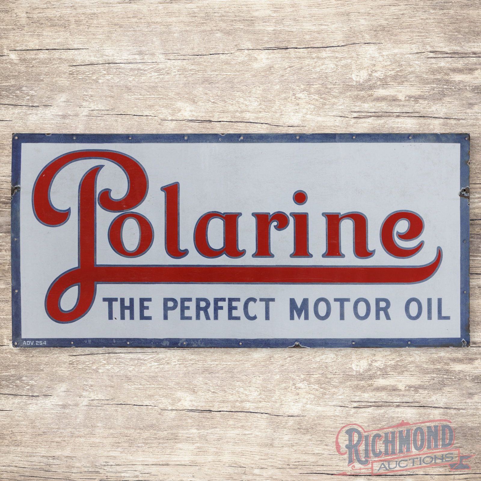 Polarine The Perfect Motor Oil 5' Single Sided Porcelain Sign: SSP (single sided porcelain) sign has good color. The field exhibits fine scratches with discoloration to the white porcelain enamel and slight fading of the blue porcelain enamel color. The outer fie