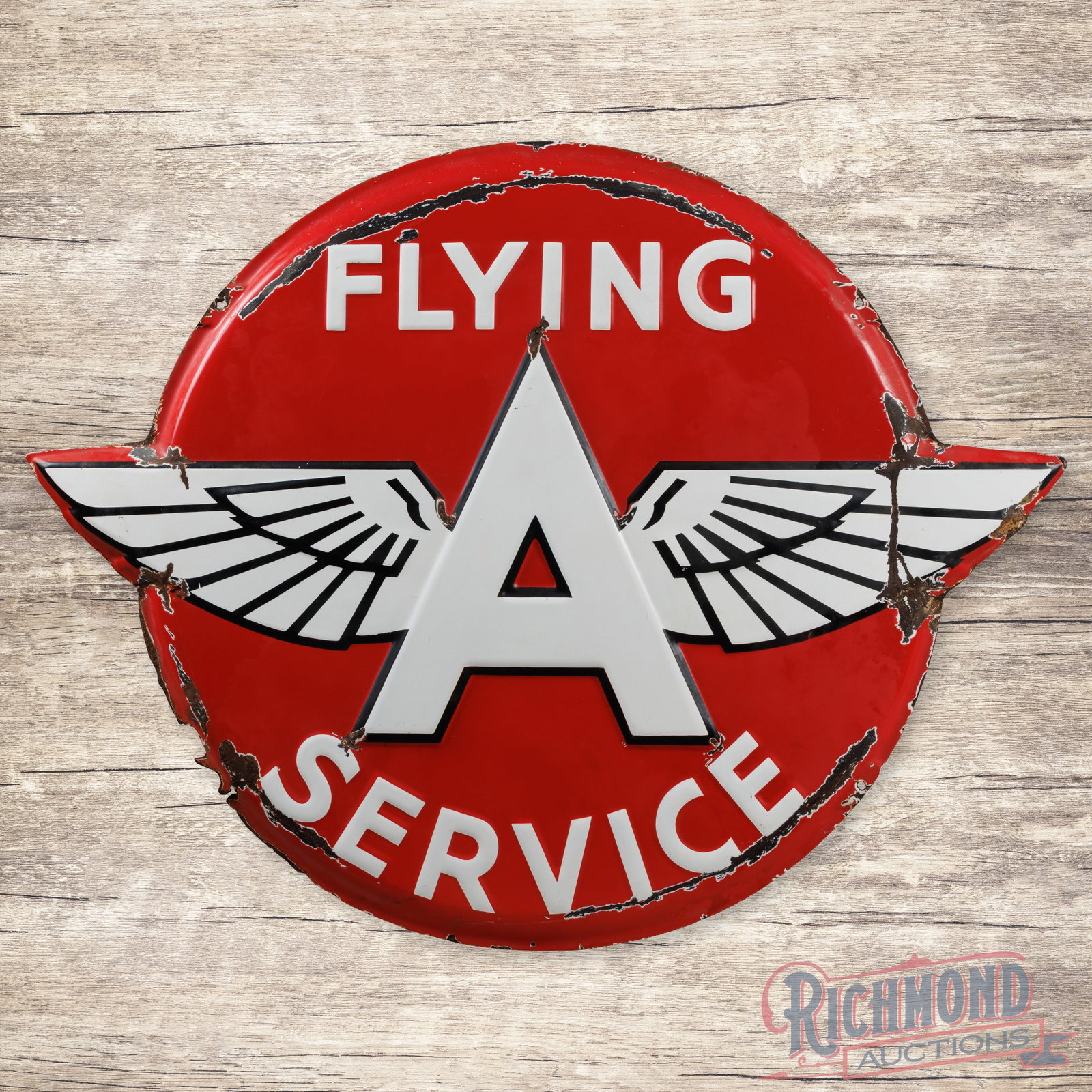 Flying A Gasoline Service 4' Emb. Single Sided Porcelain Button Sign: SSP (single sided porcelain) die cut embossed button sign has good color and gloss. The display has chips in the fields with small areas of metal loss at the top and lower left edge of the "A". The pe