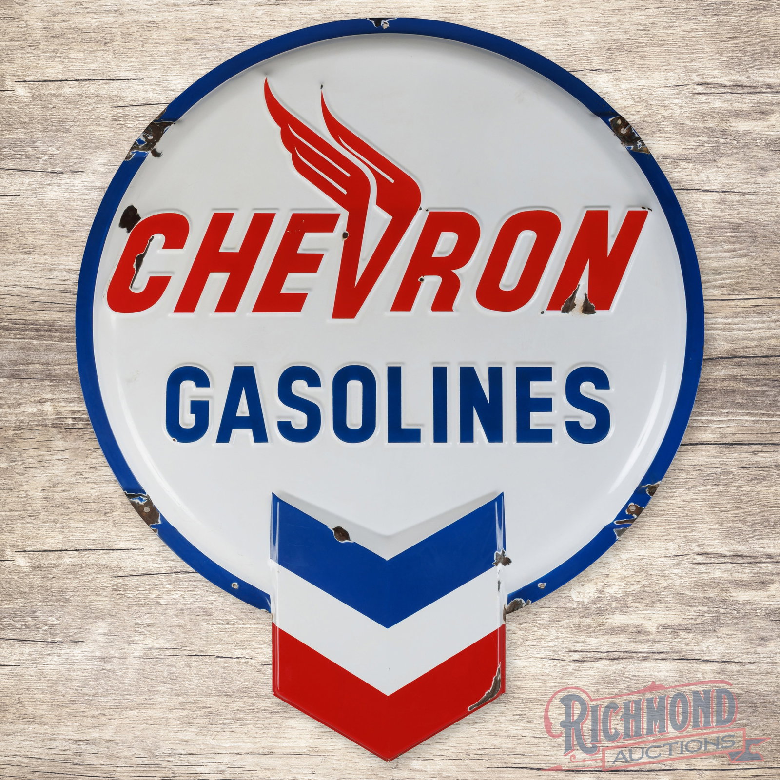 Chevron Gasoline Service 5' Emb. Single Sided Porcelain Button Sign w/ Hallmark Logo: SSP (single sided porcelain) die cut embossed button sign has very good color and gloss. The display has light wear with chips and minor areas of discoloration. The perimeter has chips on the right ed