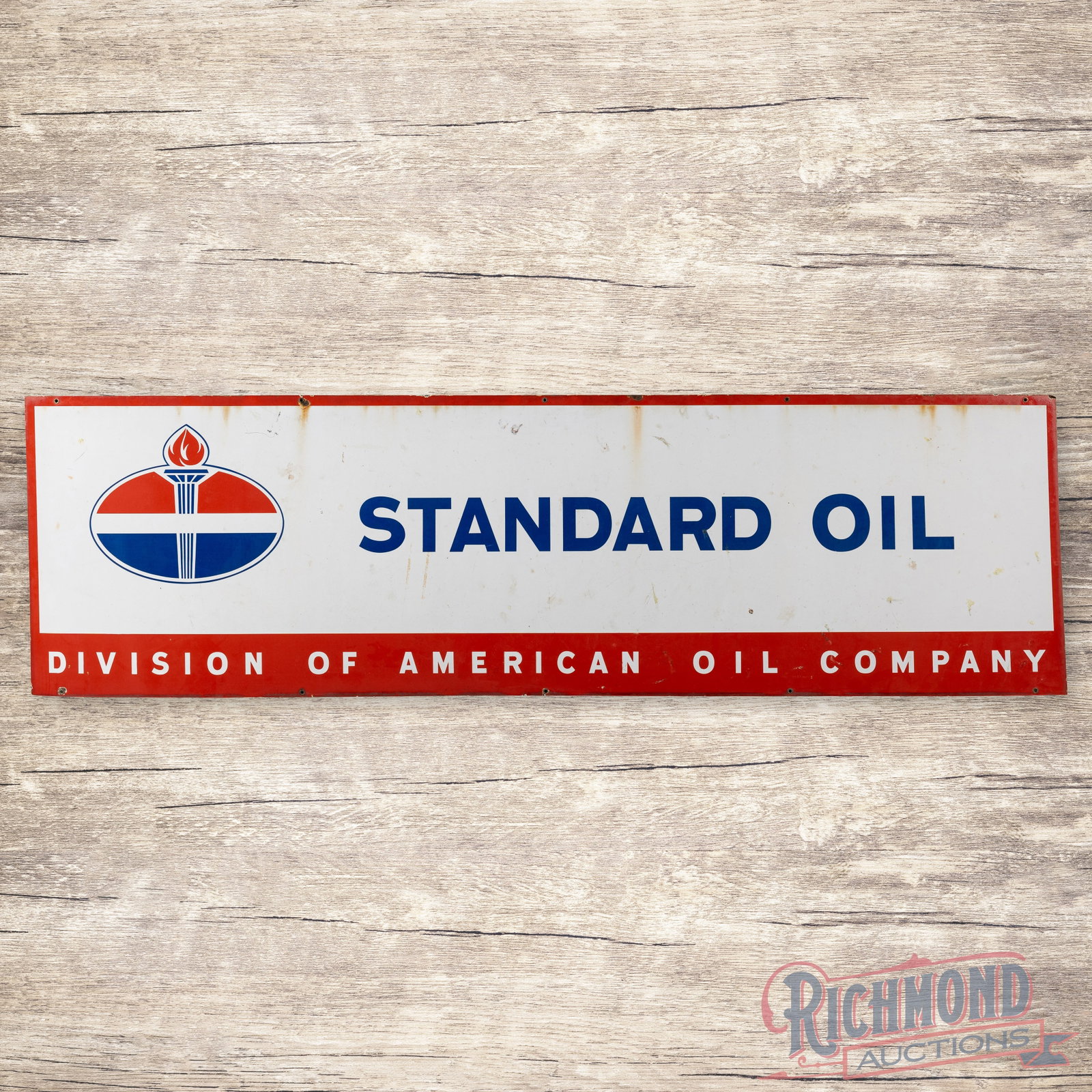 Standard Oil Division of American Oil Company 8' Single Sided Porcelain Logo Sign: SSP (single sided porcelain) sign has good color and gloss. The display has areas of surface wear with discoloration. The perimeter has small chips with a minor bend on the upper right corner. The sig