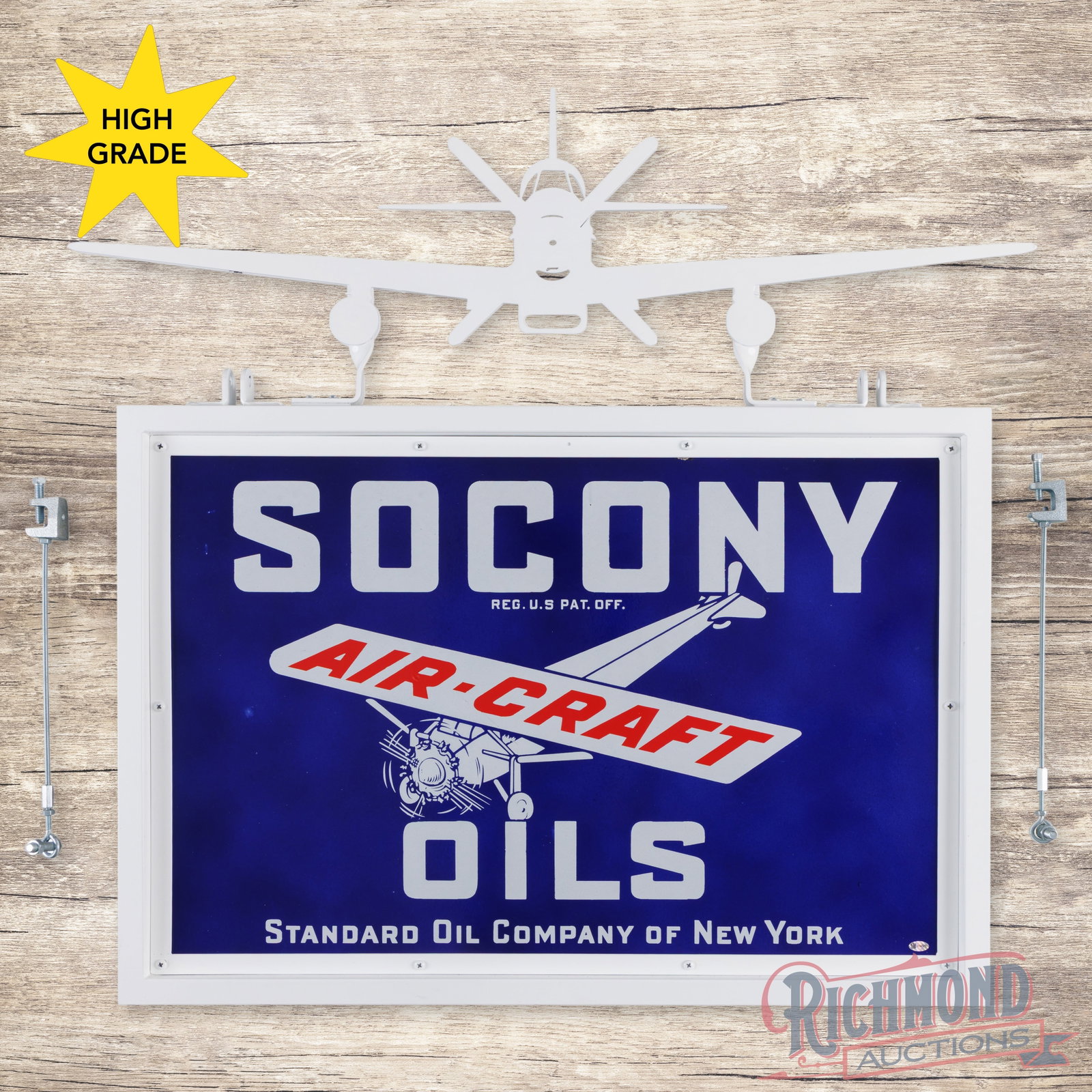 Socony Aircraft Oils 30" Single Sided Porcelain Sign w/ Custom Ring w/ Plane: SSP (single sided porcelain) sign with a custom metal frame has outstanding color and gloss. The sign features a clean field and perimeter with a chip at one upper mounting hole. The metal frame is in