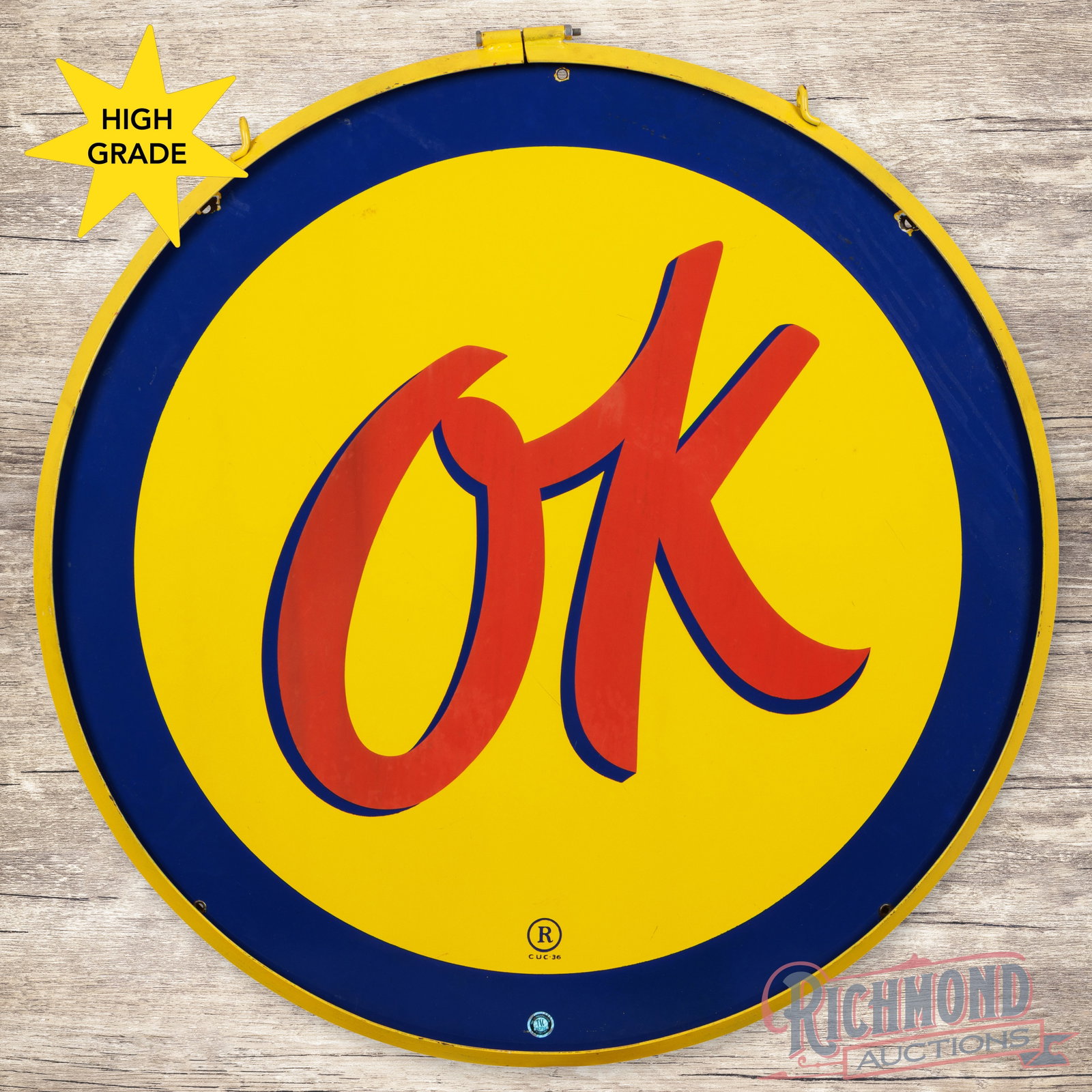 Chevrolet OK 36" Single Sided Porcelain Sign w/ Ring: SSP (single sided porcelain) sign with a metal ring has excellent color and gloss. The field is very clean overall, with minor marks and areas of discoloration in the "OK" lettering. The perimeter has