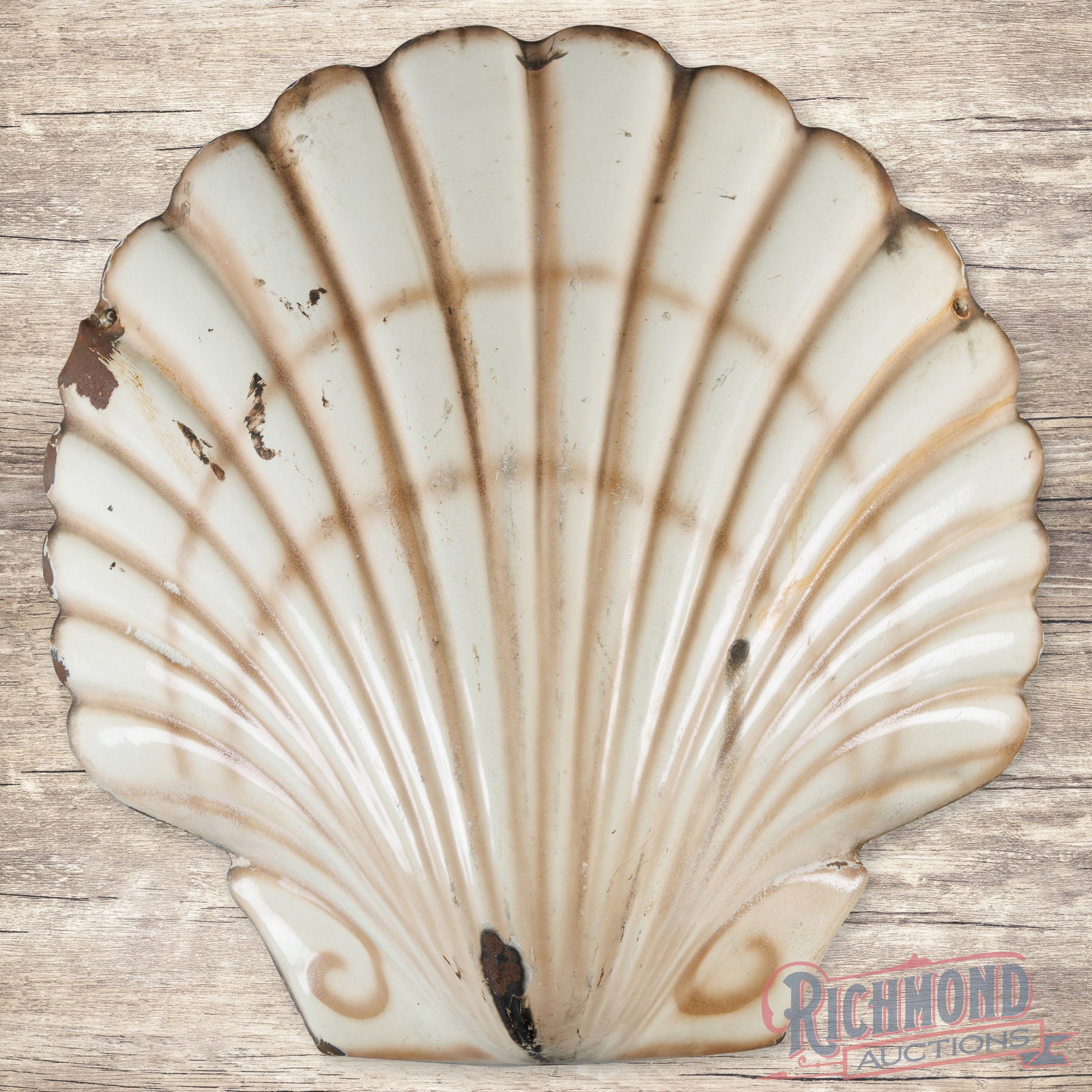 Early Shell Gasoline Service Station 3D Single Sided Porcelain Clamshell Sign: SSP (single sided porcelain) three-dimensional sign has good color and gloss. The display has surface wear with chips and areas of discoloration. The perimeter has additional chips with minor crazing 