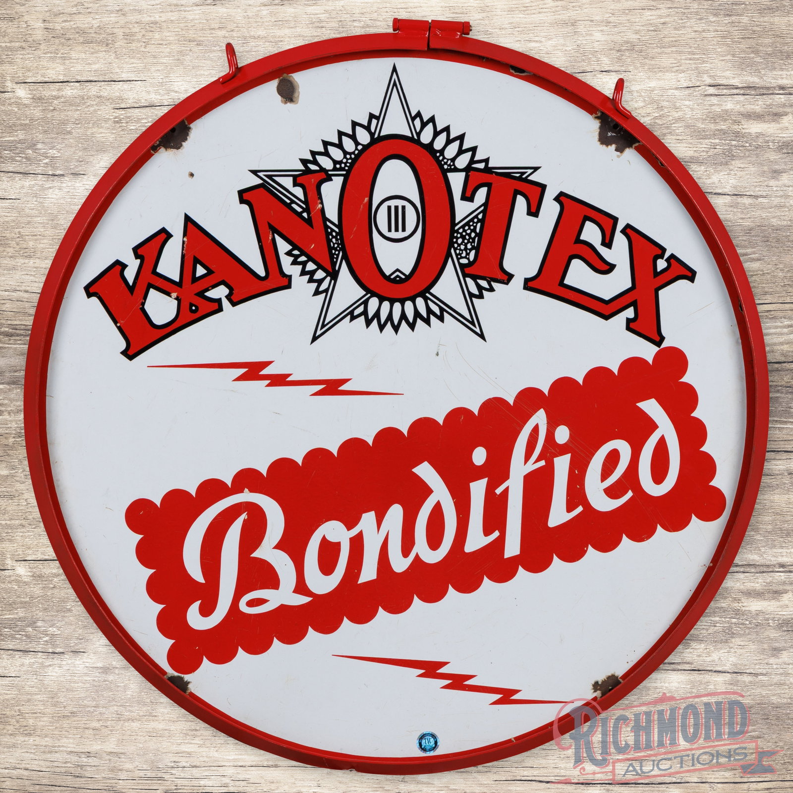 Kanotex Bondified Gasoline 30" Double Sided Porcelain Sign w/ Ring: DSP (double sided porcelain) sign with a metal ring has good color and gloss. The display has surface wear with small bruises in the left field. The perimeter has chips with areas of crazing, and two 