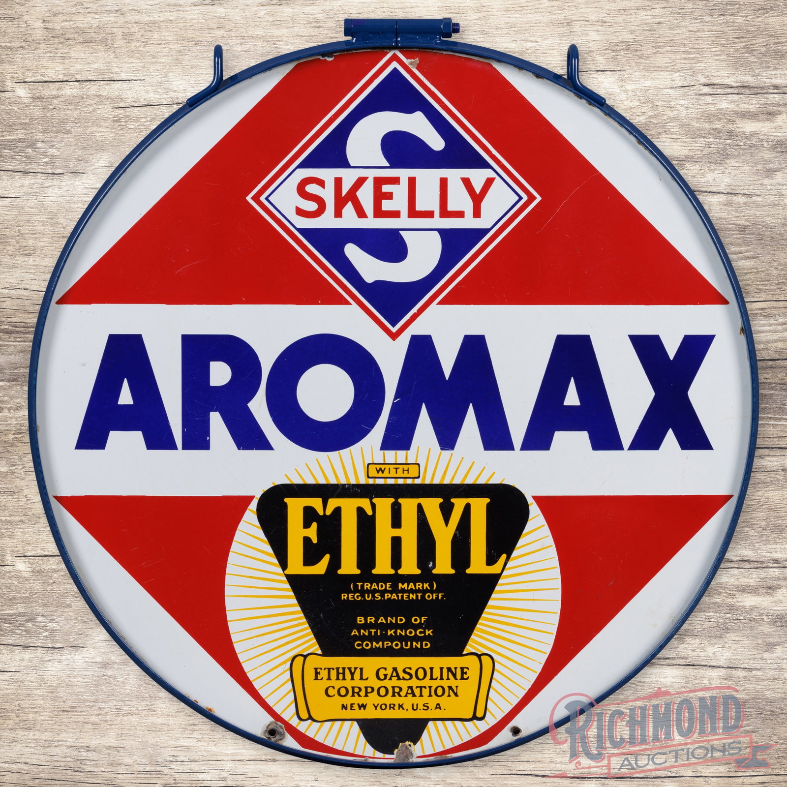 Skelly Aromax Ethyl Gasoline 30" Double Sided Porcelain Sign w/ Ring: DSP (double sided porcelain) sign with a metal ring has very good color and gloss. Side #1 has areas of surface wear with small nicks in the field. The perimeter has chips with minor areas of crazing.