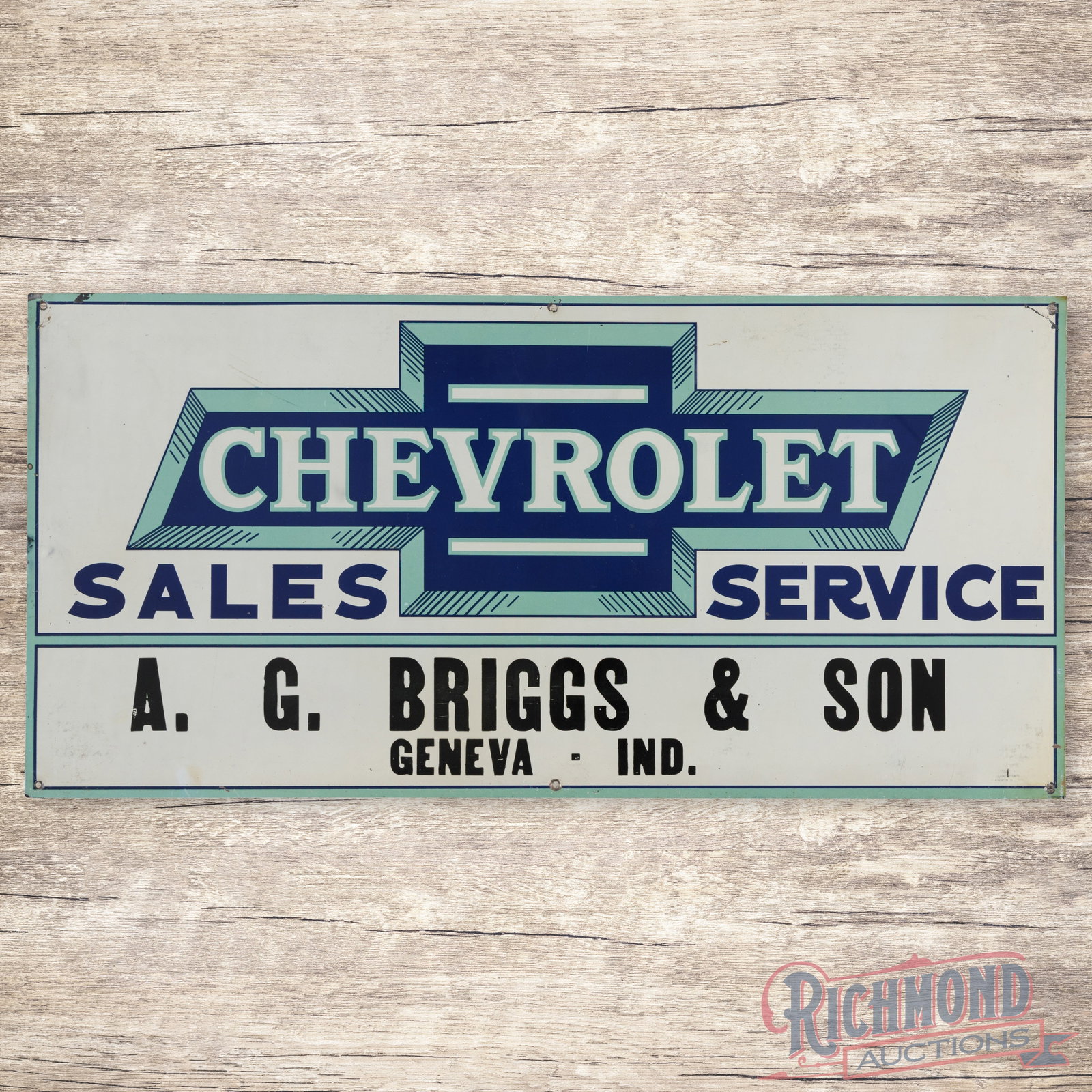 Chevrolet Sales Service A.G. Briggs & Son Geneva Ind. Emb. Single Sided Tin Sign w/ Bowtie: SST (single sided tin) embossed tacker sign has excellent color and shine. The field has faint paper marks with light wear. The outer fields and perimeter have minor bends with small paint chips. The 