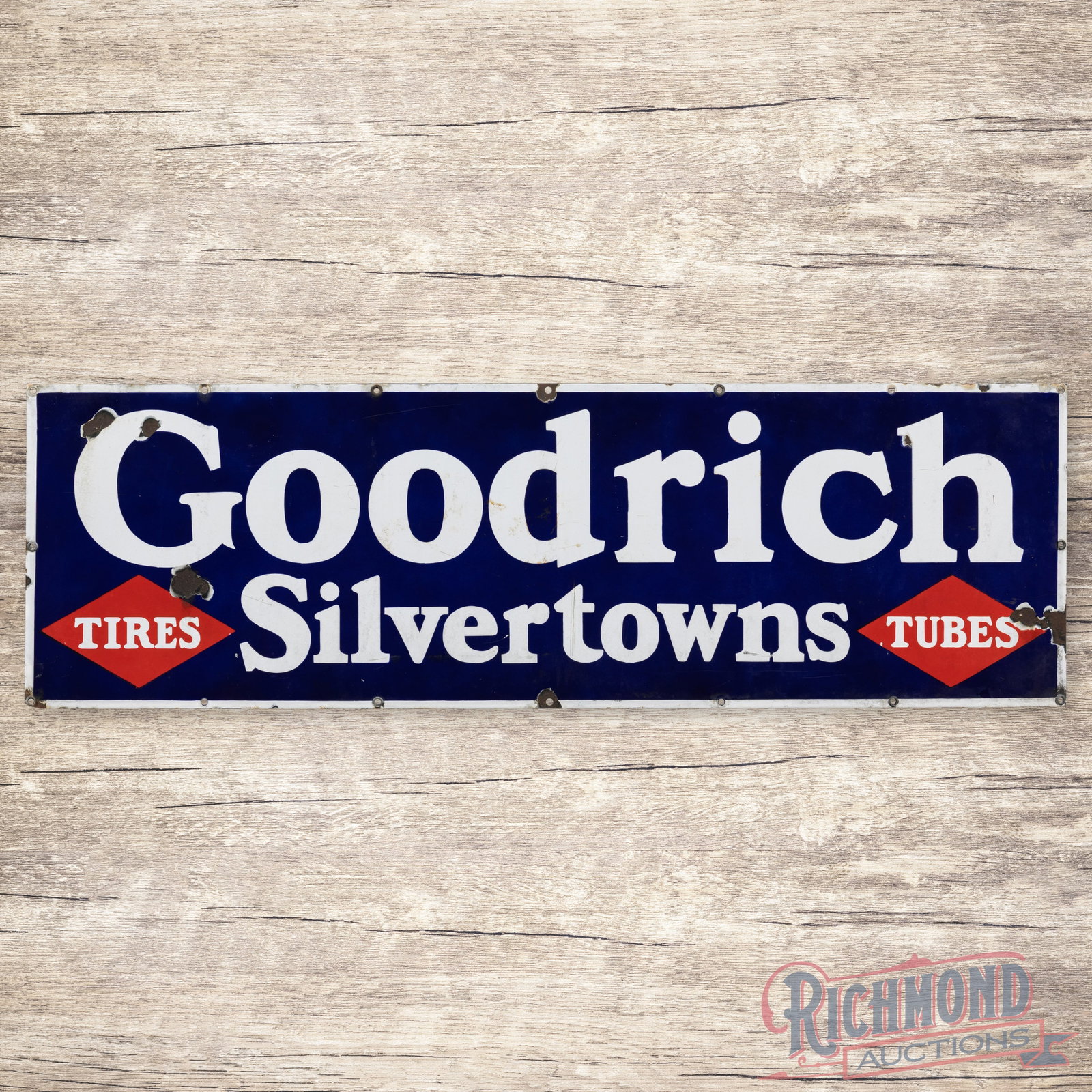 Goodrich Silvertowns Tires Tubes 5' Single Sided Porcelain Sign: SSP (single sided porcelain) sign has very good color and gloss. The display has light wear with chips in the outer fields. The perimeter has areas of minor discoloration with chips at the mounting ho