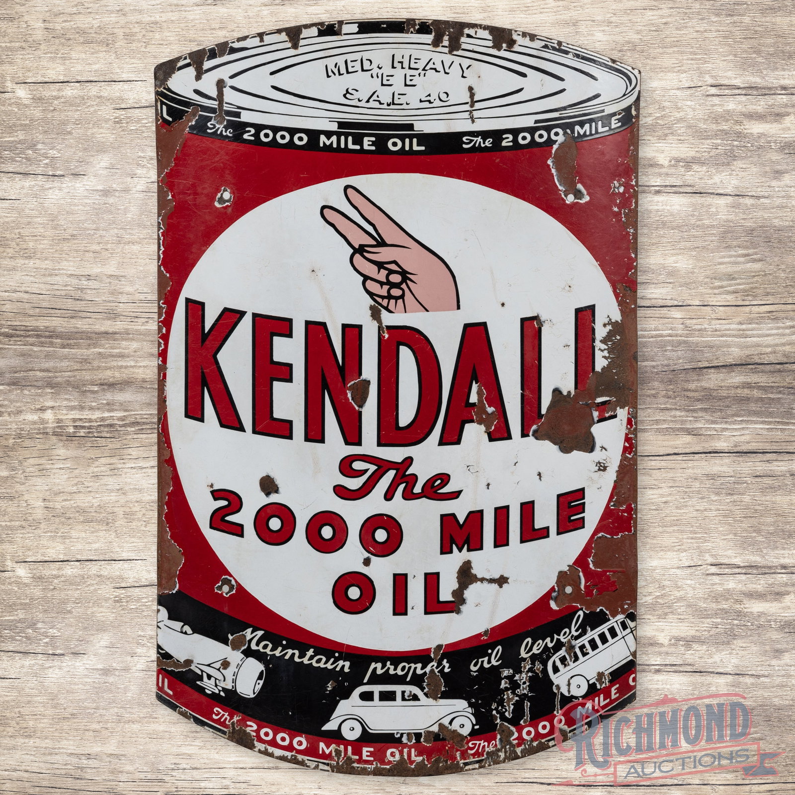 Kendall The 2000 Mile Oil Curved Single Sided Porcelain Sign: SSP (single sided porcelain) curved sign has good color and gloss. The display has chips with crazing and areas of discoloration. The perimeter has larger chips, minor bends and errant red paint. The 