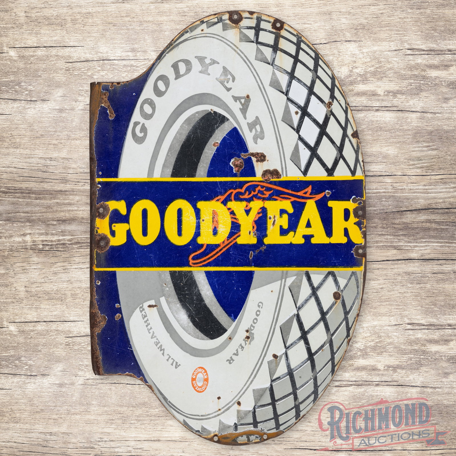 Goodyear All Weather Tires Double Sided Porcelain Flange Sign: DSP (double sided porcelain) flange has good color and moderate gloss. The display has chips with surface wear and crazing in the fields. The perimeter has non-factory holes, bends and additional chip