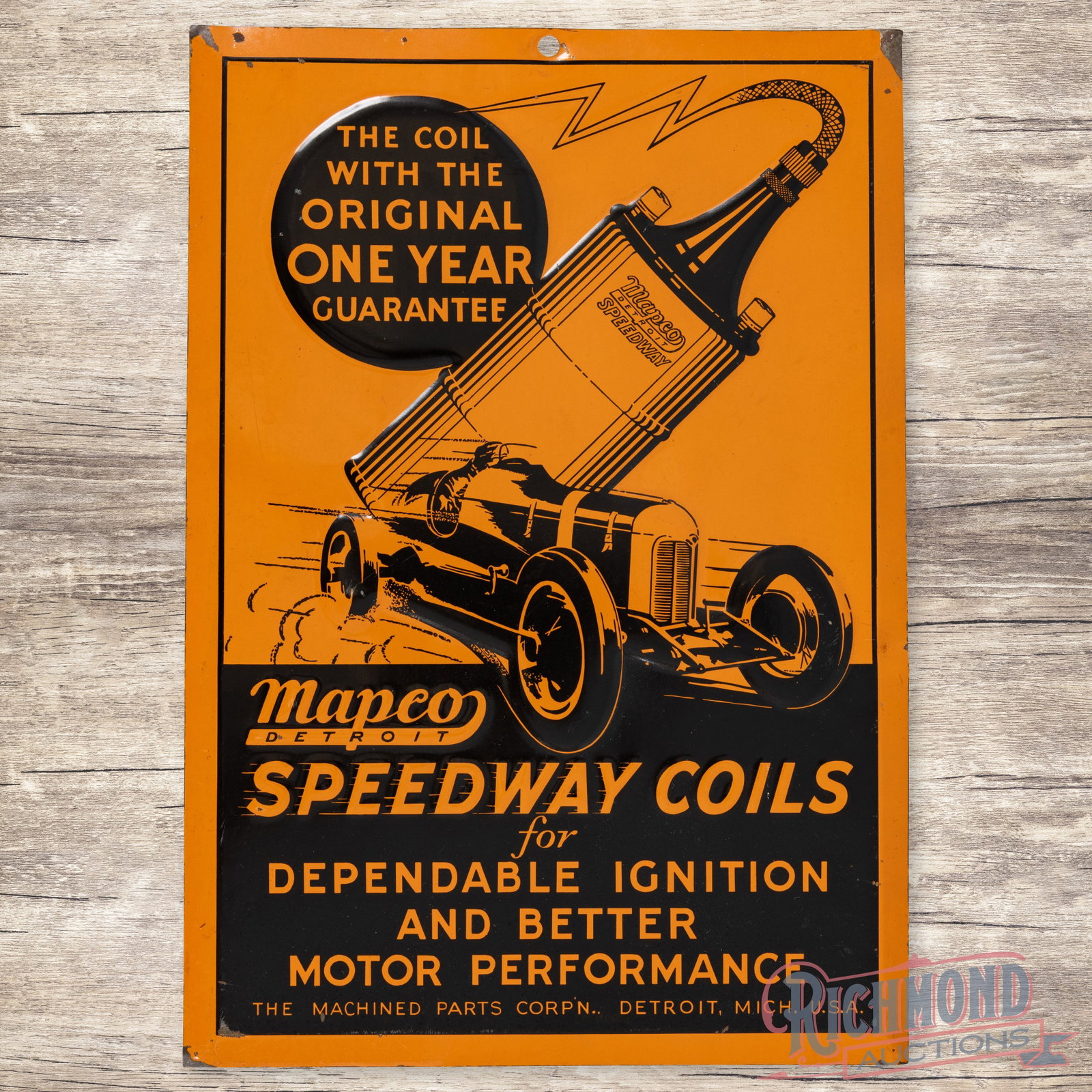 Mapco Speedway Coils Emb. Single Sided Tin Sign w/ Race Car: SST (single sided tin) embossed sign has excellent color and shine. The field is very clean overall with a few tiny paint chips. The perimeter has light edge bends with paint chips along the corners. 