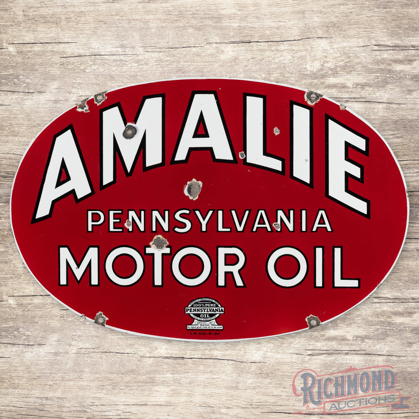 Amalie Pennsylvania Motor Oil 30" Double Sided Porcelain Sign: DSP (double sided porcelain) sign has very good color and gloss. The display has chips with three non-factory holes in the field. The perimeter has additional chips with three non-factory holes along 