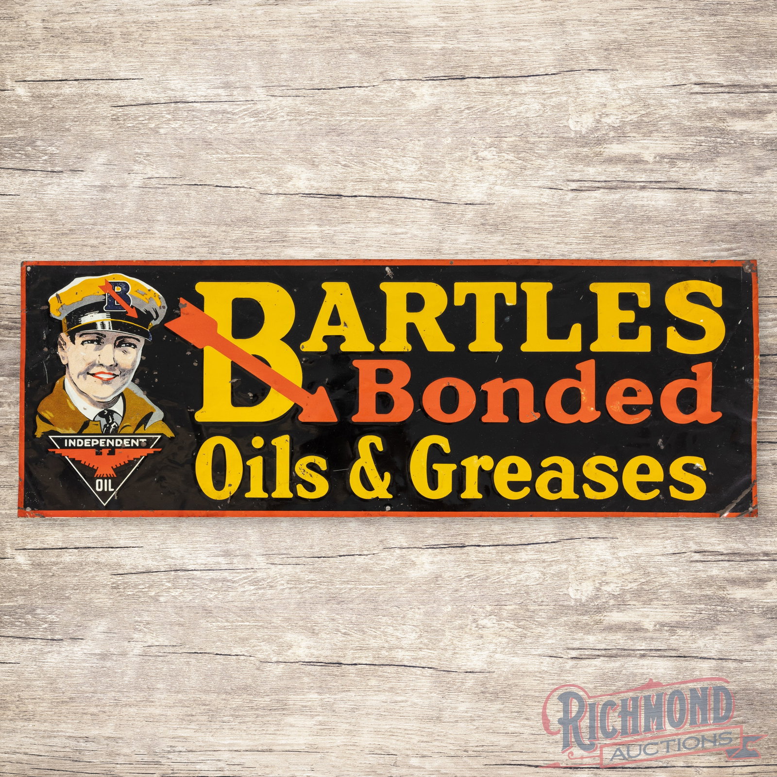Bartles Bonded Oils & Greases w/ Independent Logo: SST (single sided tin) embossed sign has good color and shine. The display has paint chips, small fine scratches and numerous tiny dings. The outer fields and perimeter have bends with areas of paint 