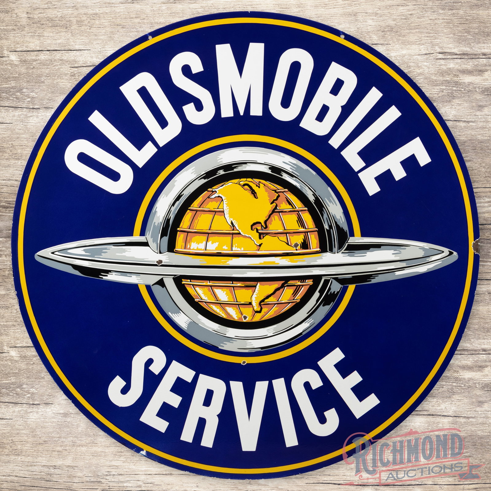 Oldsmobile Service 5' Double Sided Porcelain Sign w/ World Logo: DSP (double sided porcelain) sign has excellent color and gloss. The display has small chips in the field with a few additional chips along the outer edges. The reverse is in a similar condition to th